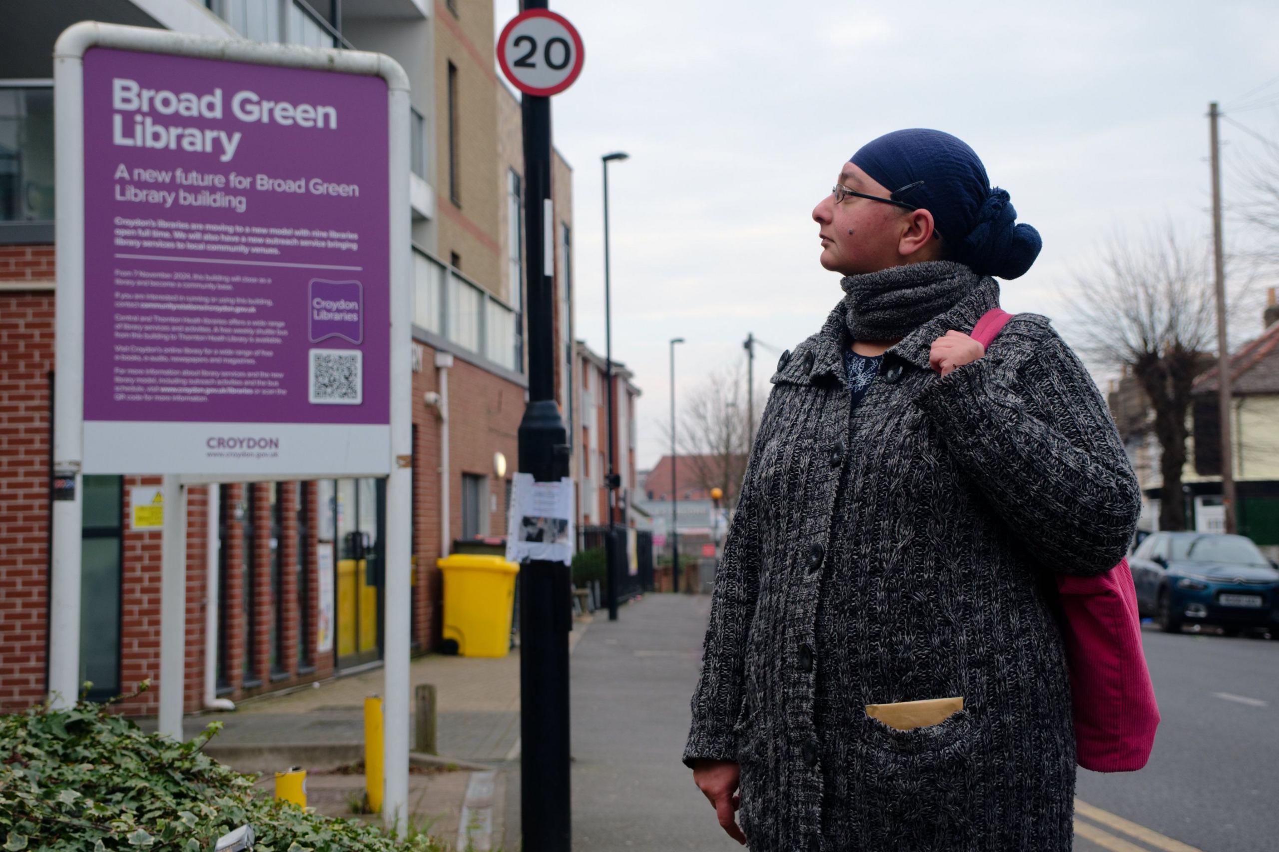 Kiran Choda stands looking at the now closed Broad Green Library