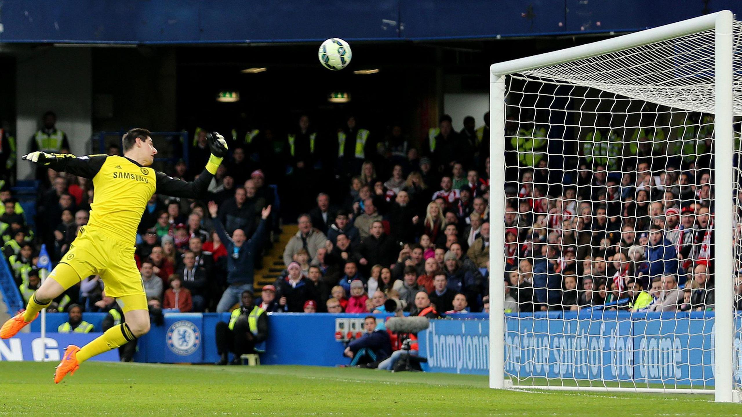 Thibaut Courtois is beaten by Charlie Adam's long-range strike