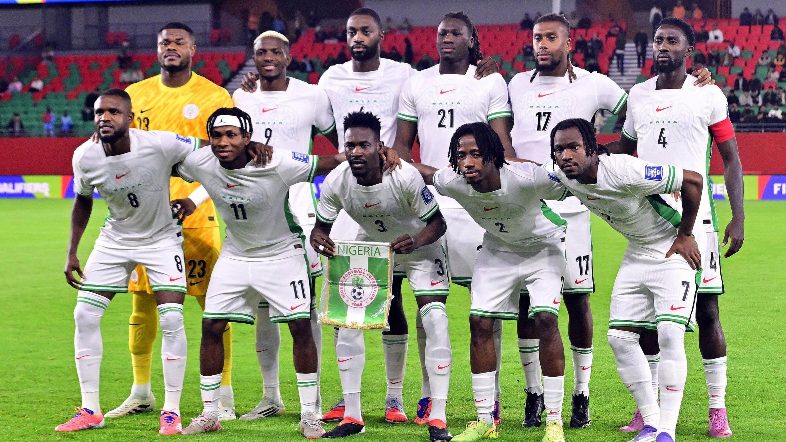 Nigeria players line up for a team photograph before a game