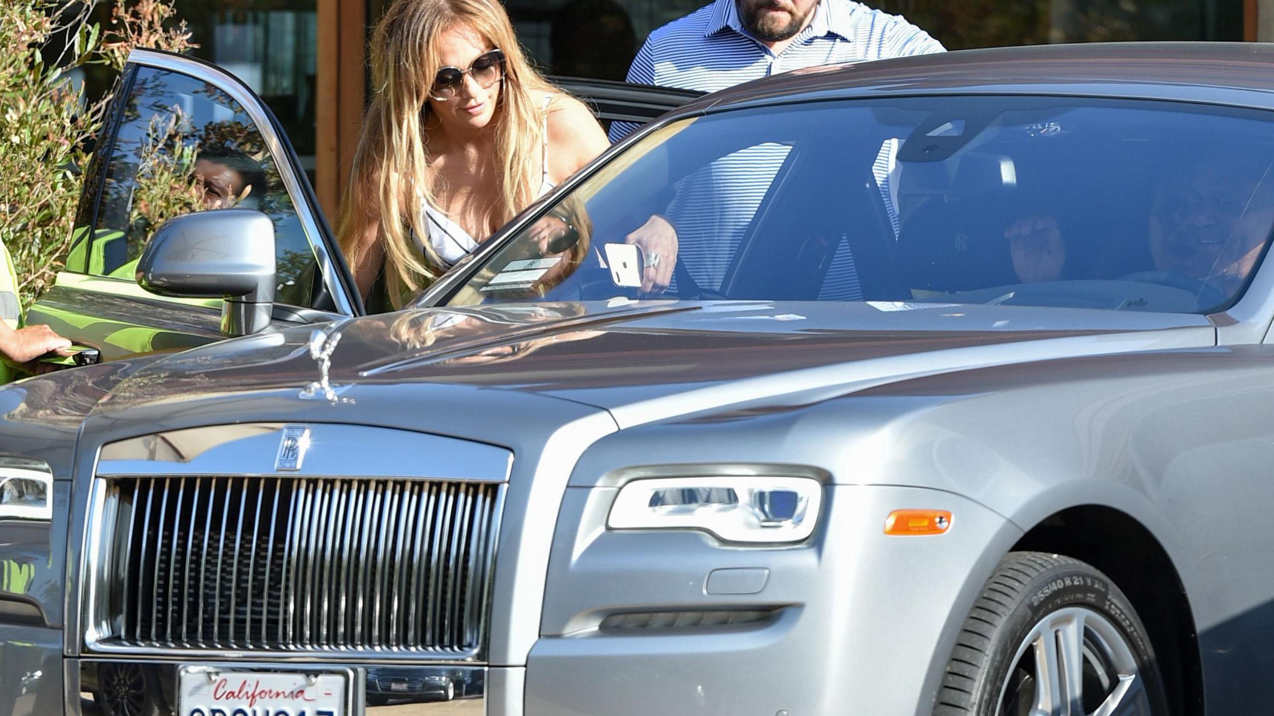 Singer Jennifer Lopez seen getting into a silver Rolls-Royce in Los Angeles