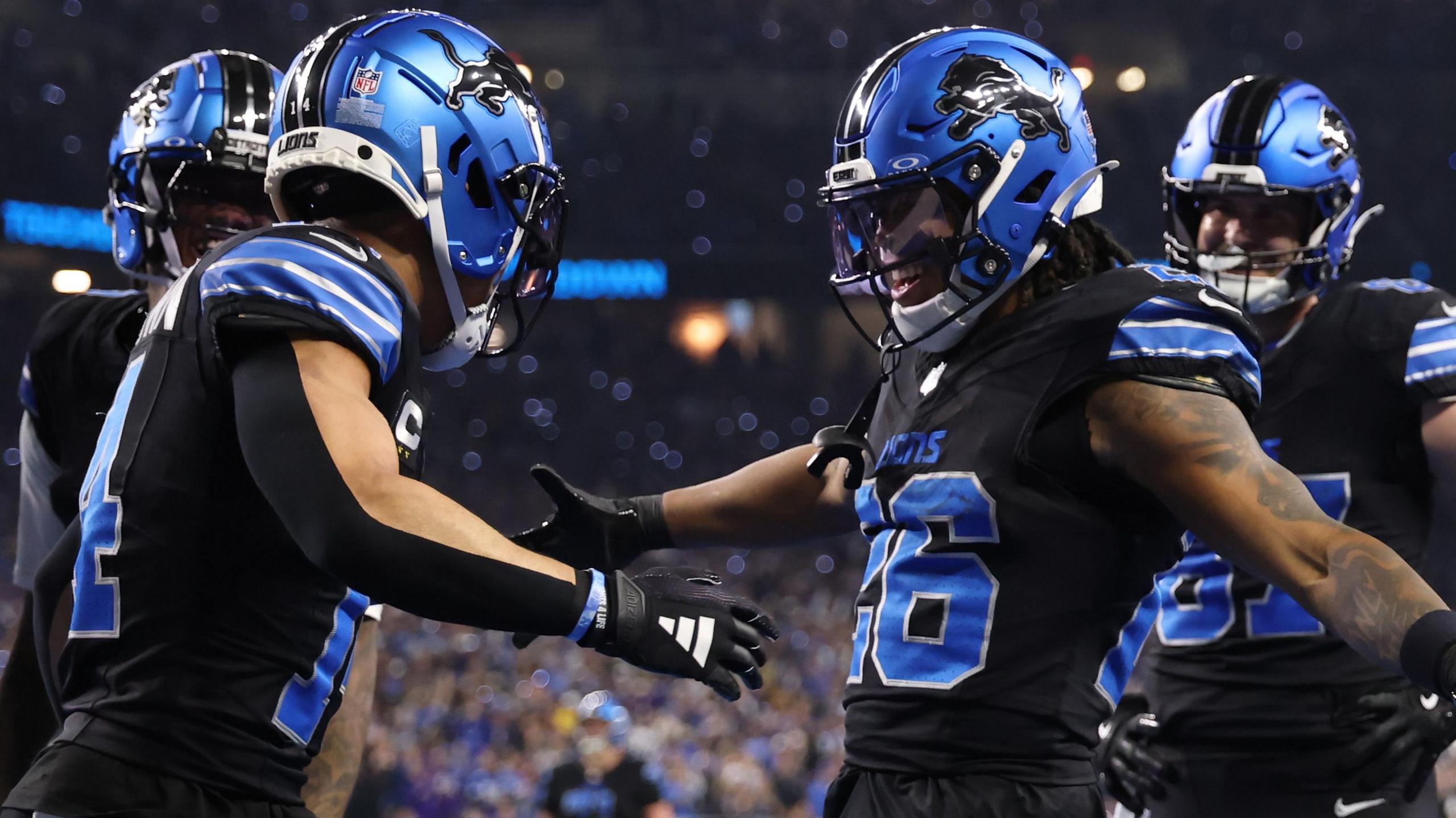 Detroit Lions players celebrate a touchdown against the Minnesota Vikings in the NFL