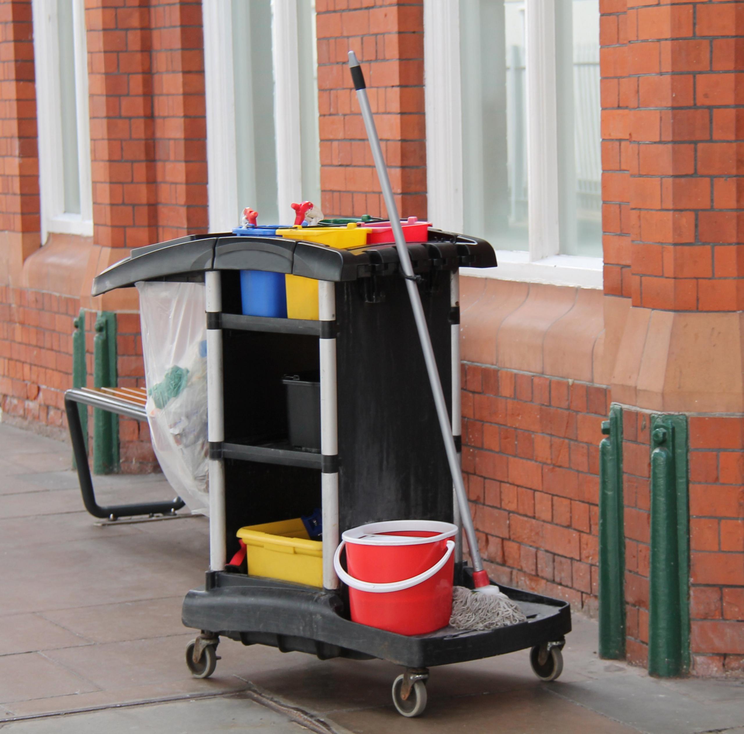 A Large Trolley with Cleaning Equipment and Materials.