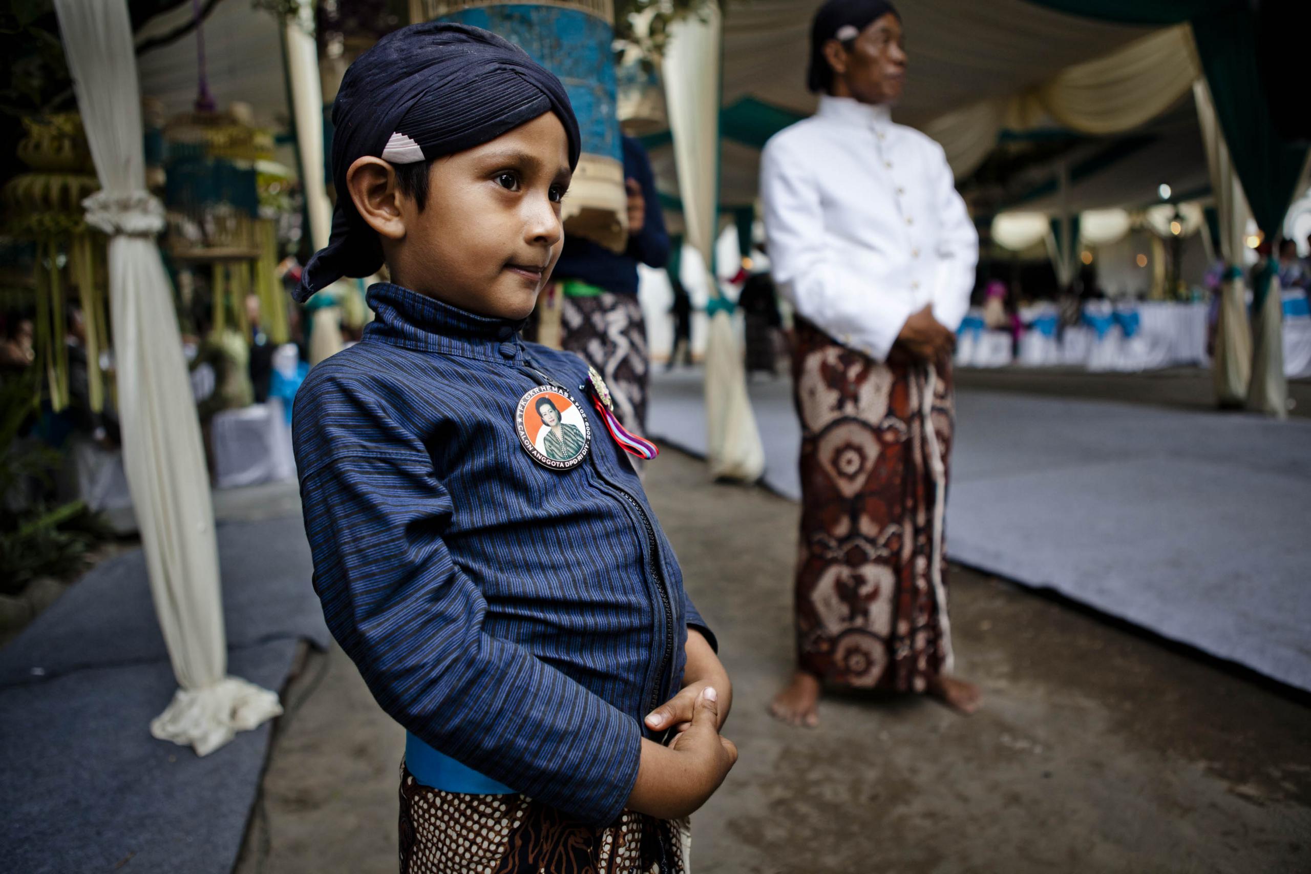 Yogya boy wearing campaign image of the Queens bid for the senate.