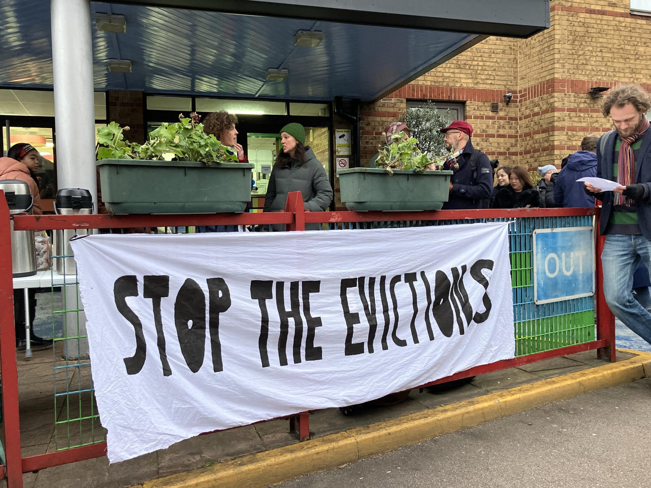 Protesters gather outside the hotel on Thursday morning