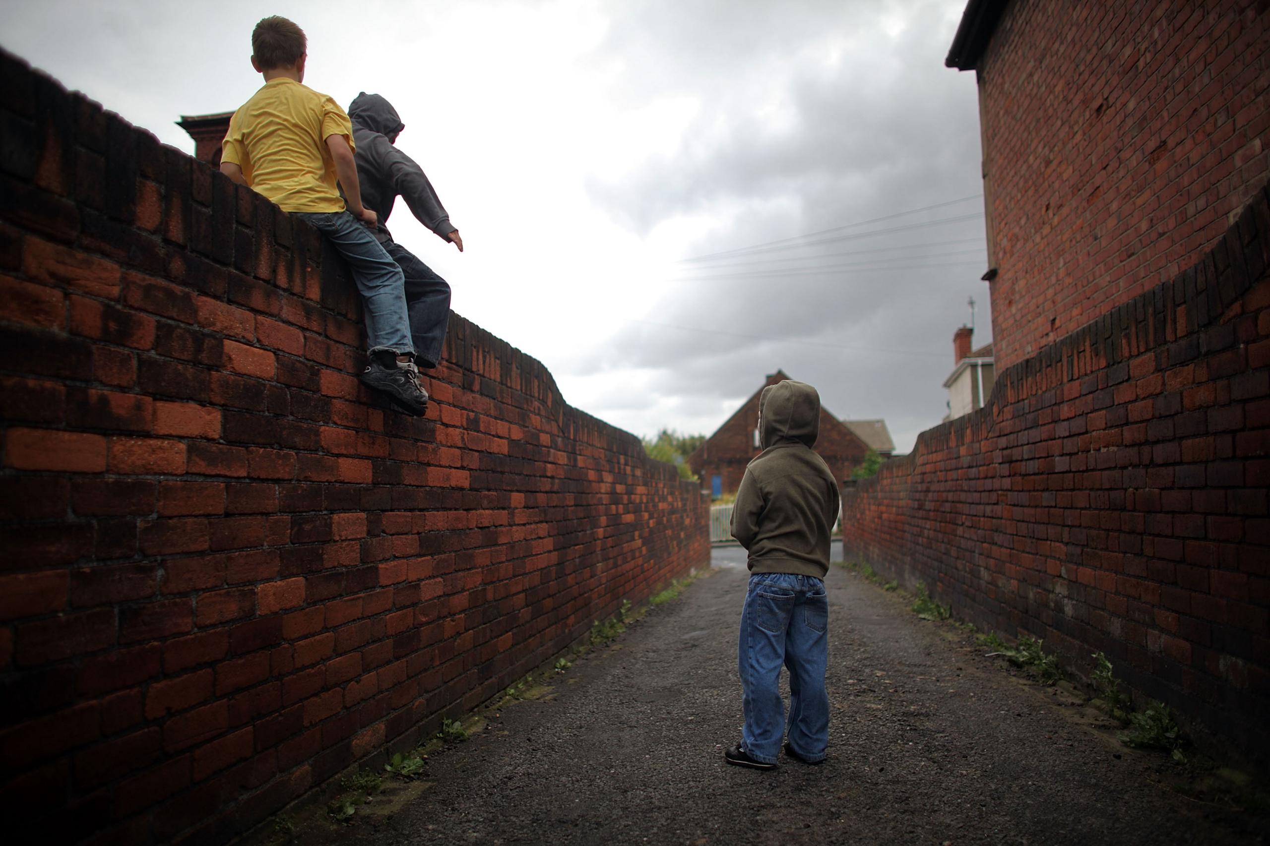 Boys playing in alleyway