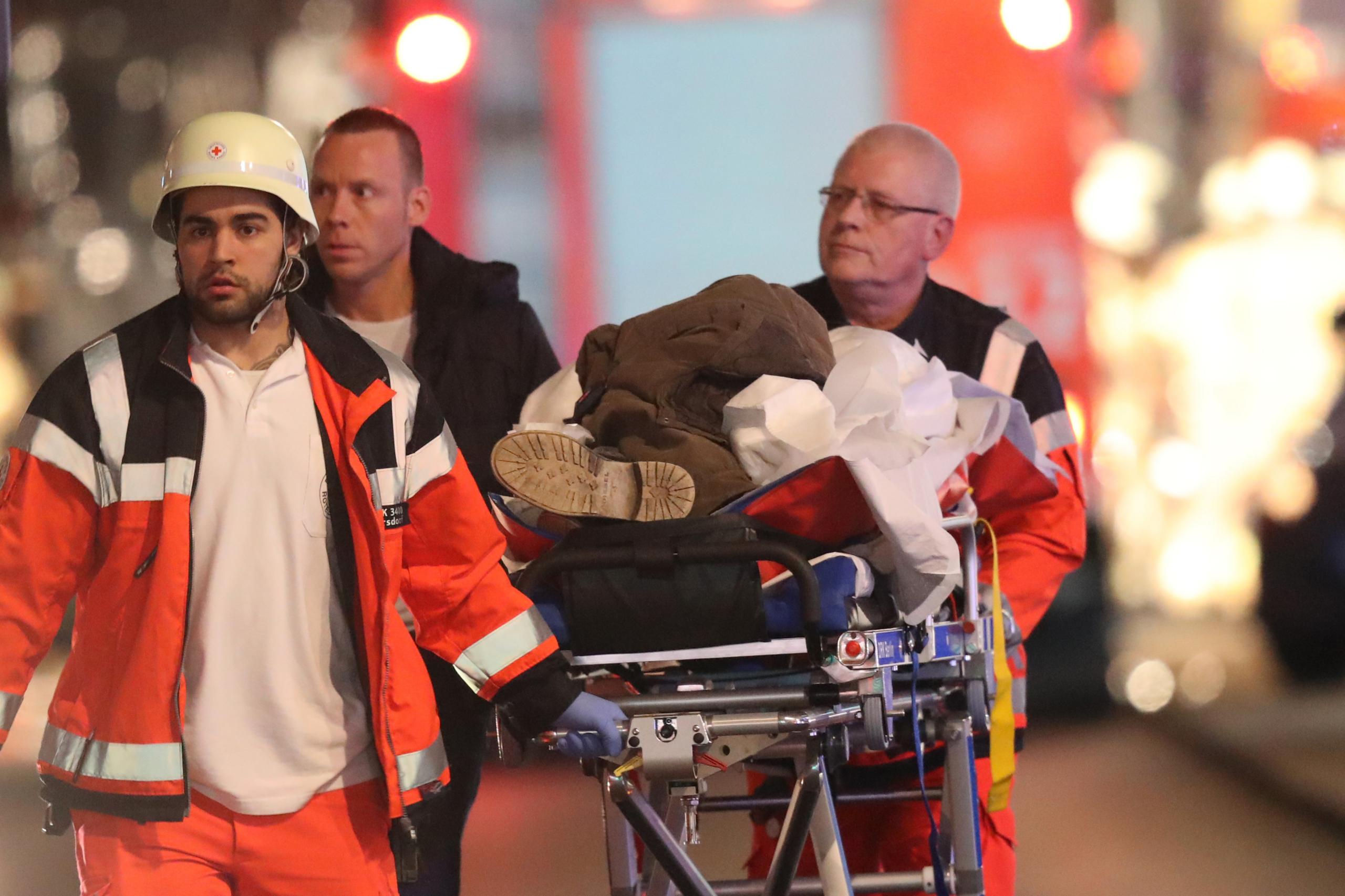 Emergency workers with an injured person in Berlin, 19 December