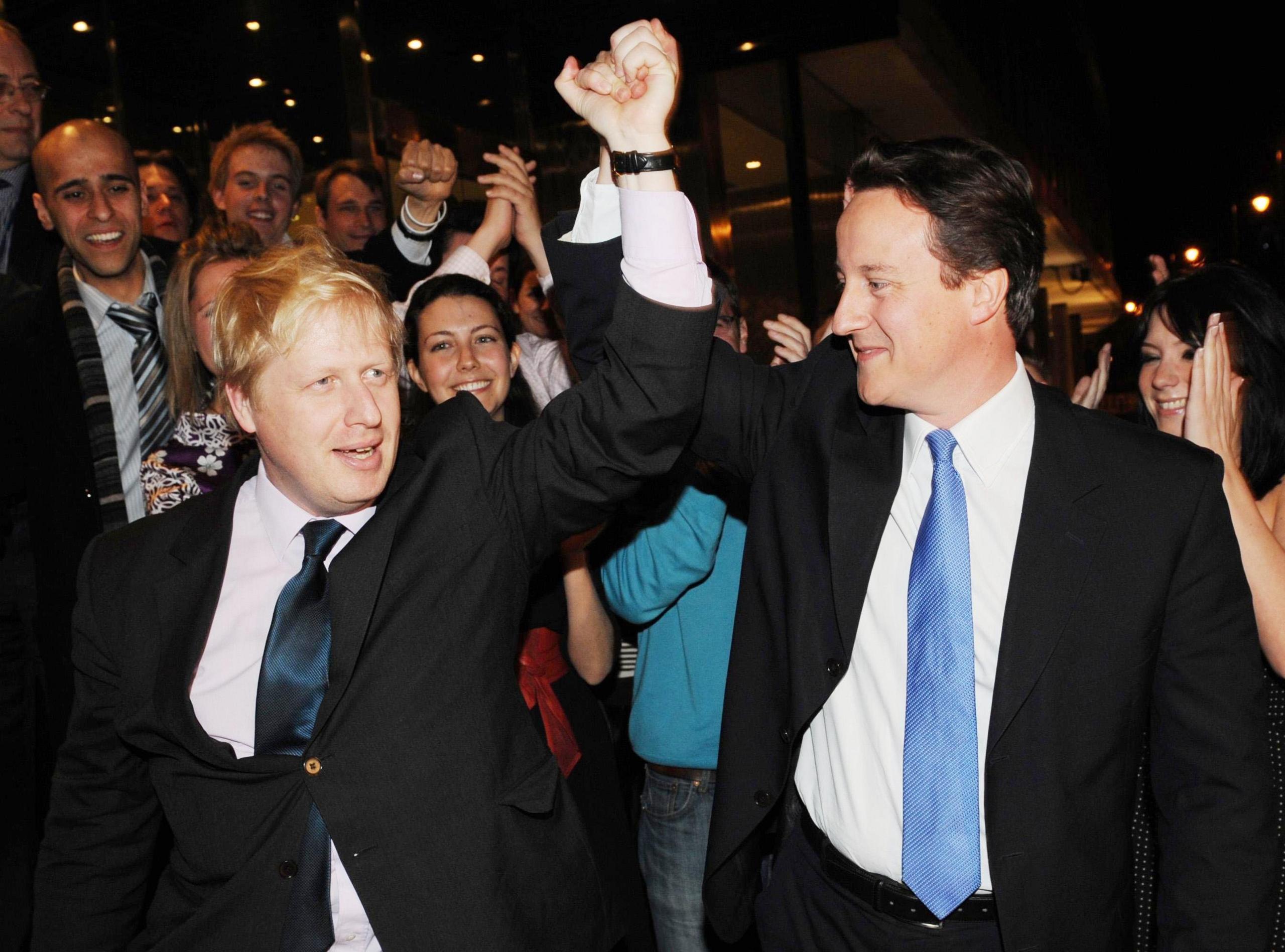 Conservative Party leader David Cameron congratulates Boris Johnson on becoming London Mayor at Tory HQ in central London