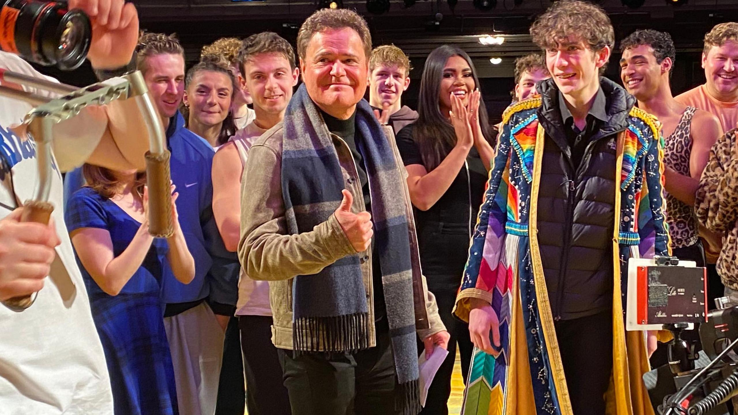 Matthew English pictured with Donny Osmond filming The One Show. Matthew is wearing a scarf from Joseph and the Amazing Technicolor Dreamcoat.