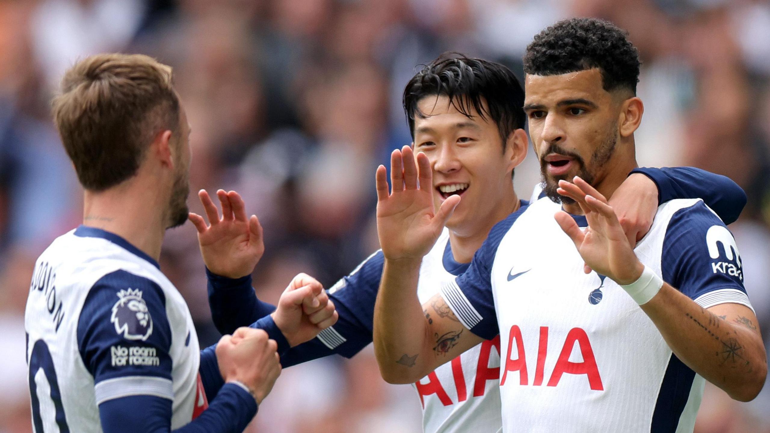 Dominic Solanke celebrates scoring his first goal for Tottenham against Brentford with team-mates Son Heung-min and James Maddison