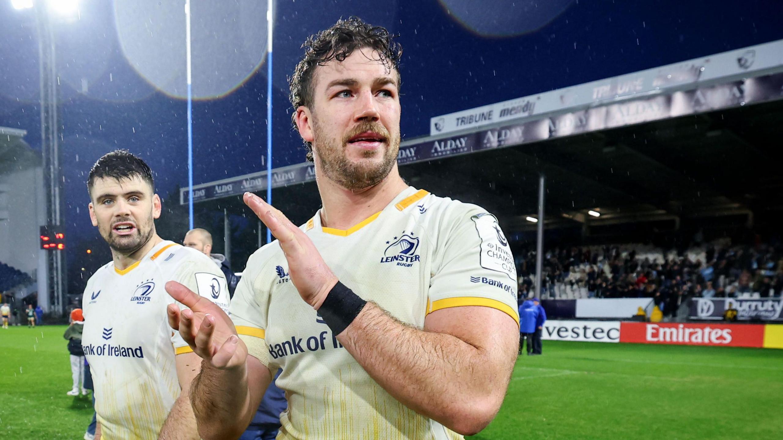 Caelan Doris claps the fans alongside Harry Byrne