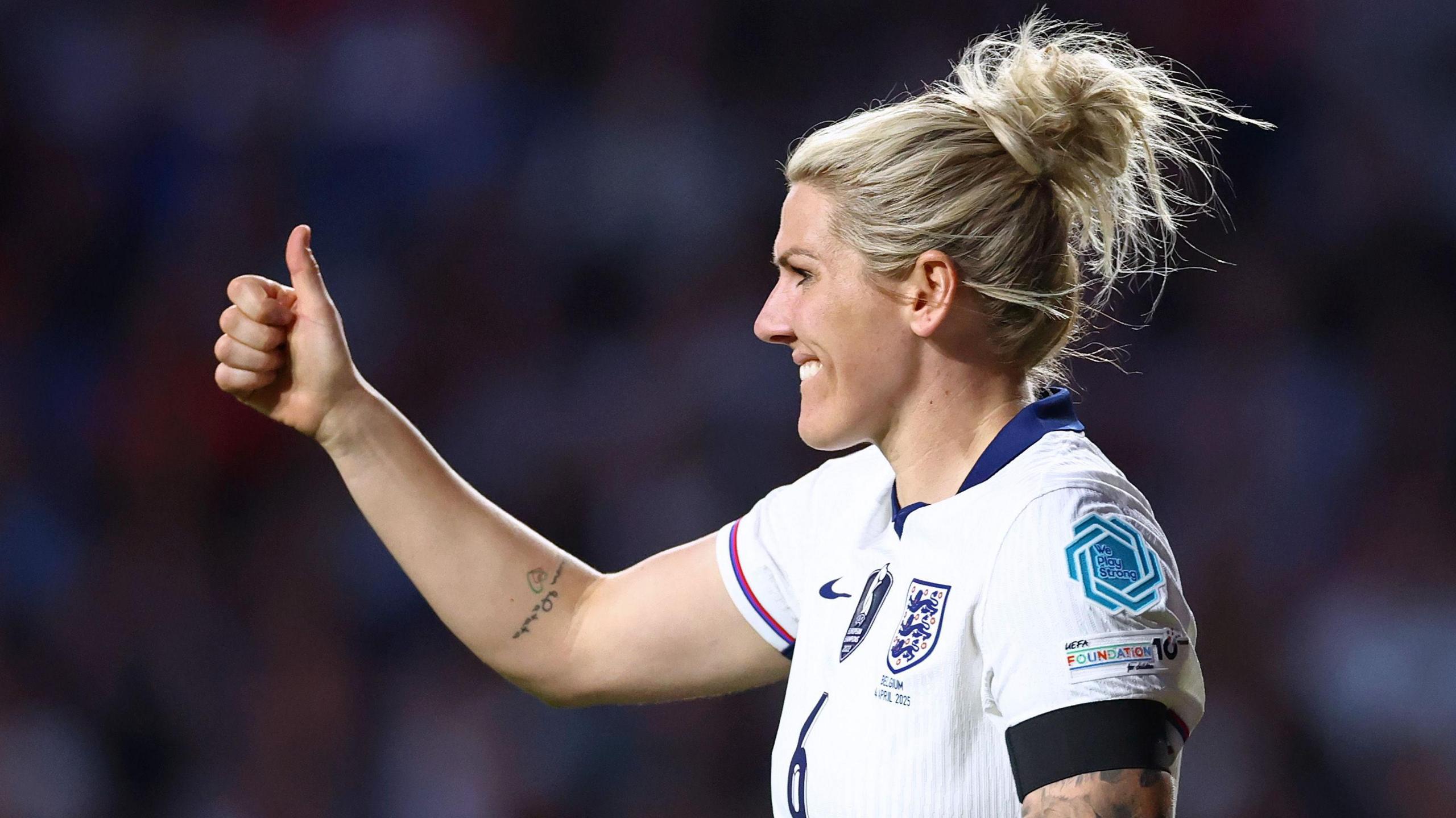 Millie Bright gives a thumbs-up
