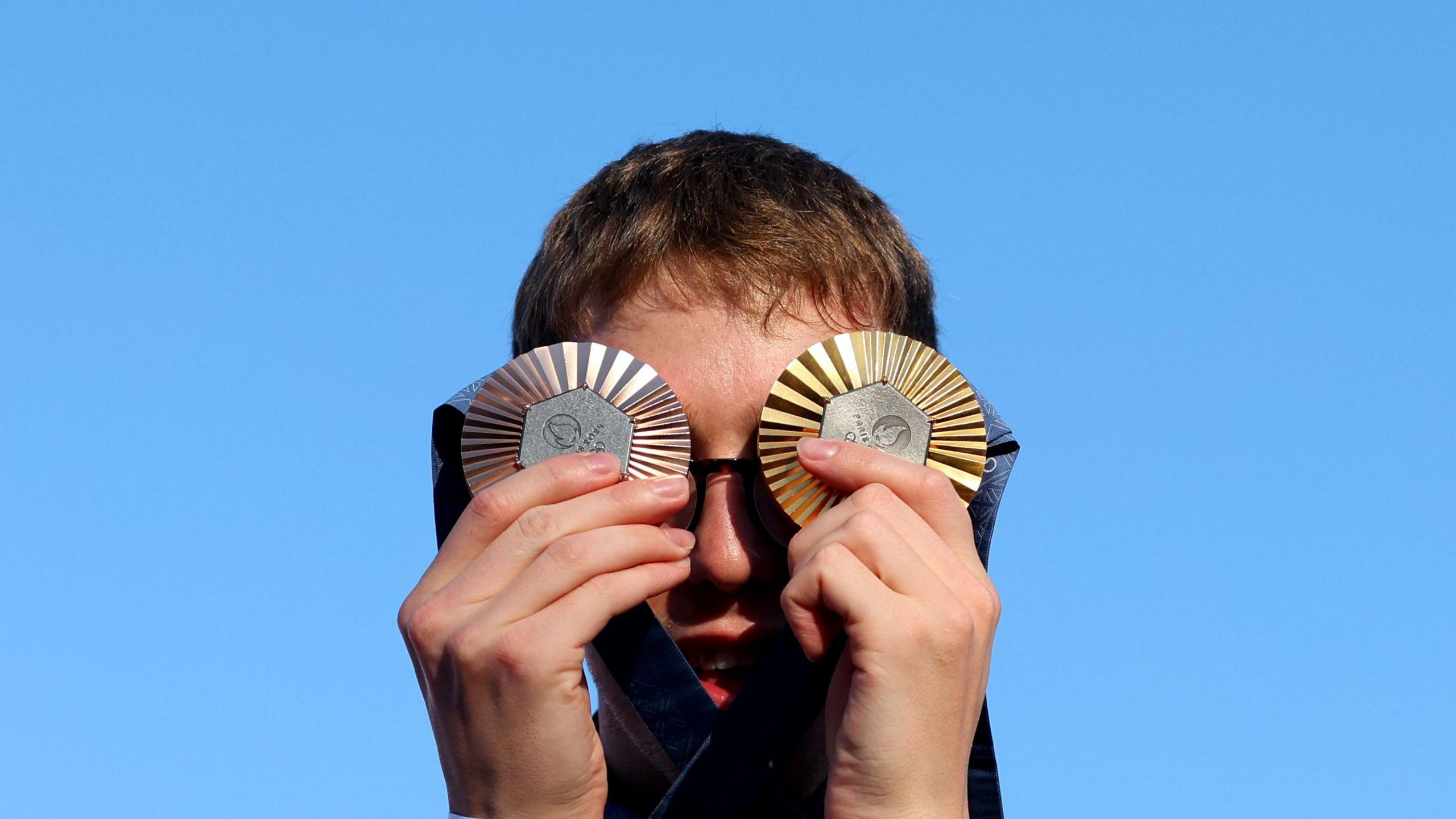 Swimmer Daniel Wiffen pictured with his Olympic gold and bronze medals in Paris. 