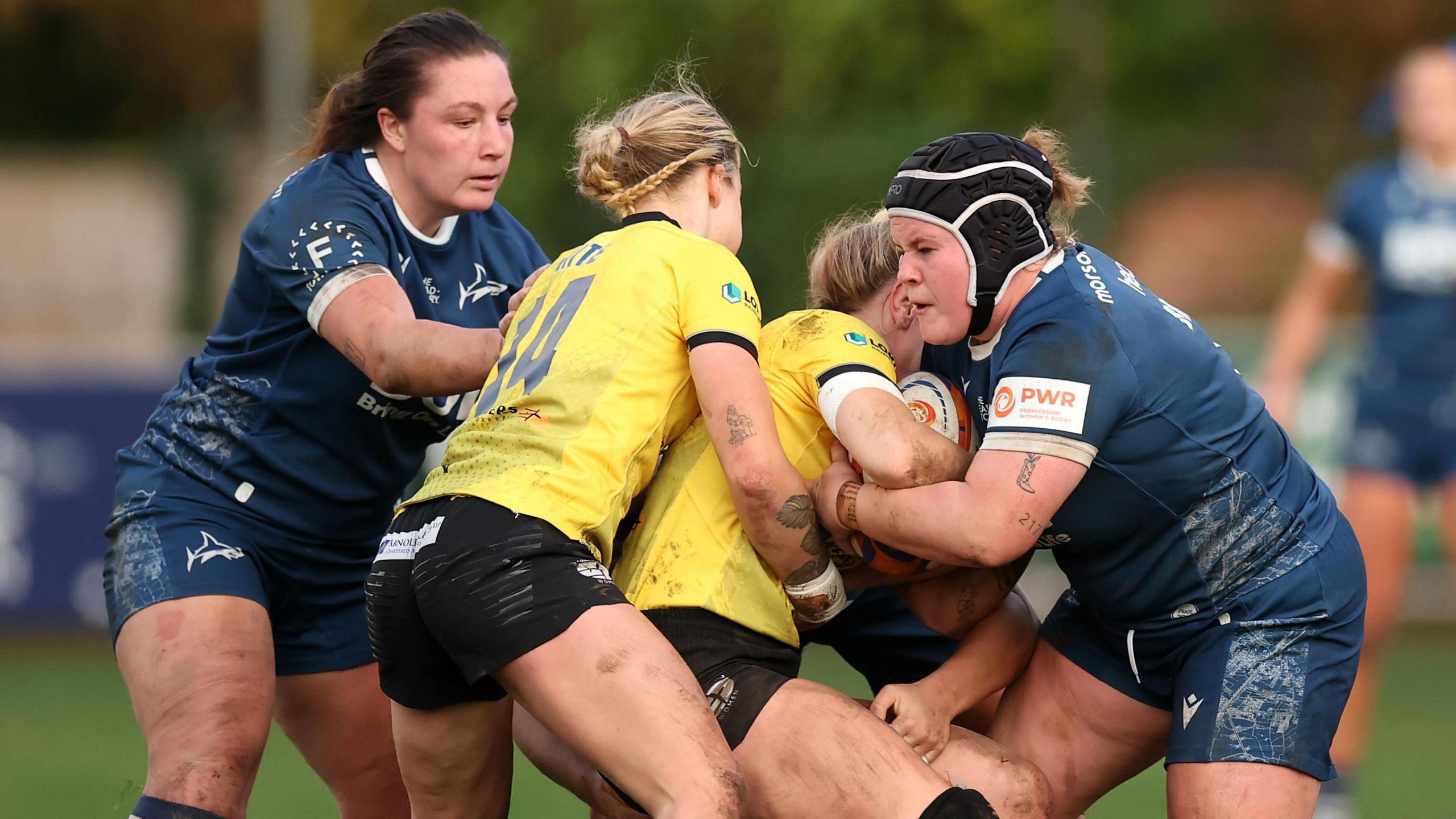 Sale Sharks and Trailfinders players battle for the ball