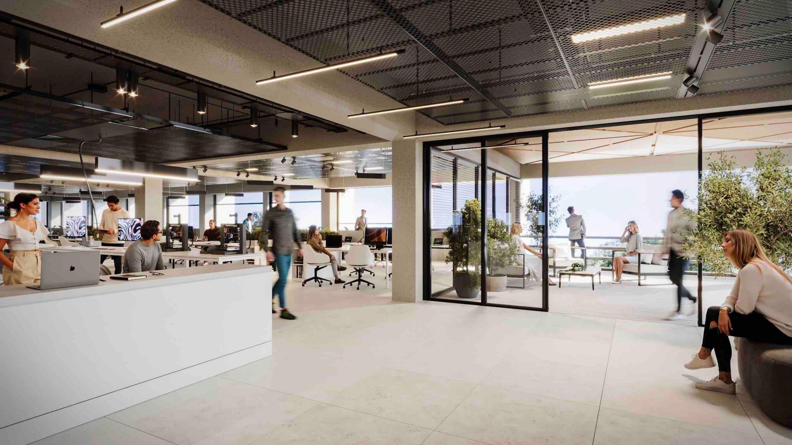 Mock-up image of the inside of one of the planned buildings. It is open plan with shared desk areas and an outdoor patio.