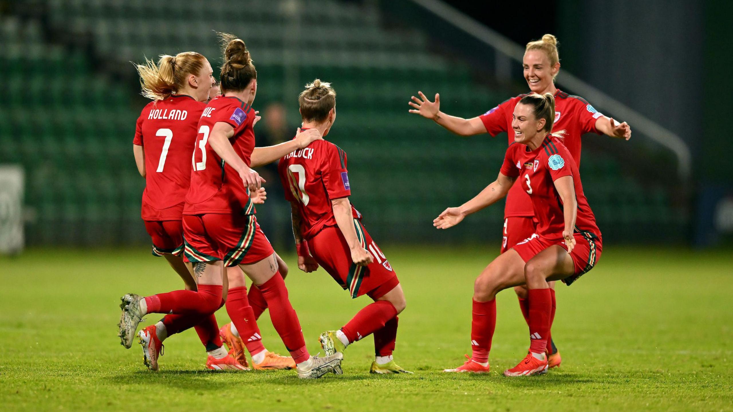 Jess Fishlock celebrates her goals with her team-mates