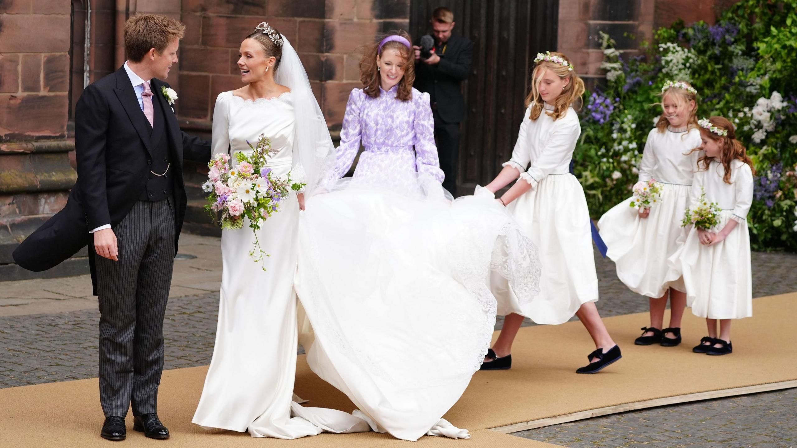 Olivia Henson and Hugh Grosvenor, the Duke of Westminster  and their bridesmaids leave Chester Cathedral after their weddin