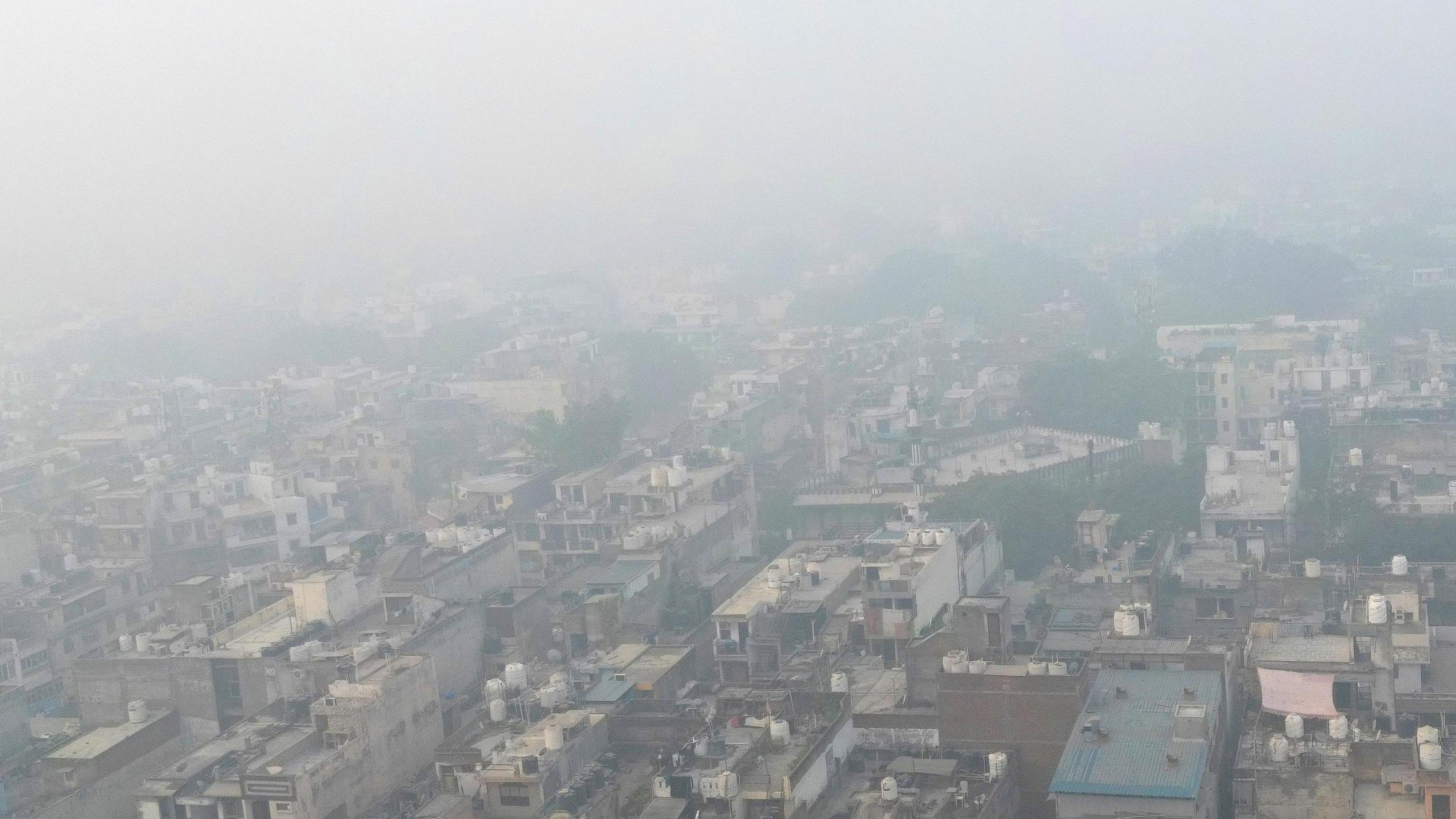 An aerial view of Delhi's built-up houses barely visible as they are engulfed in smog on 14 November, 2024.