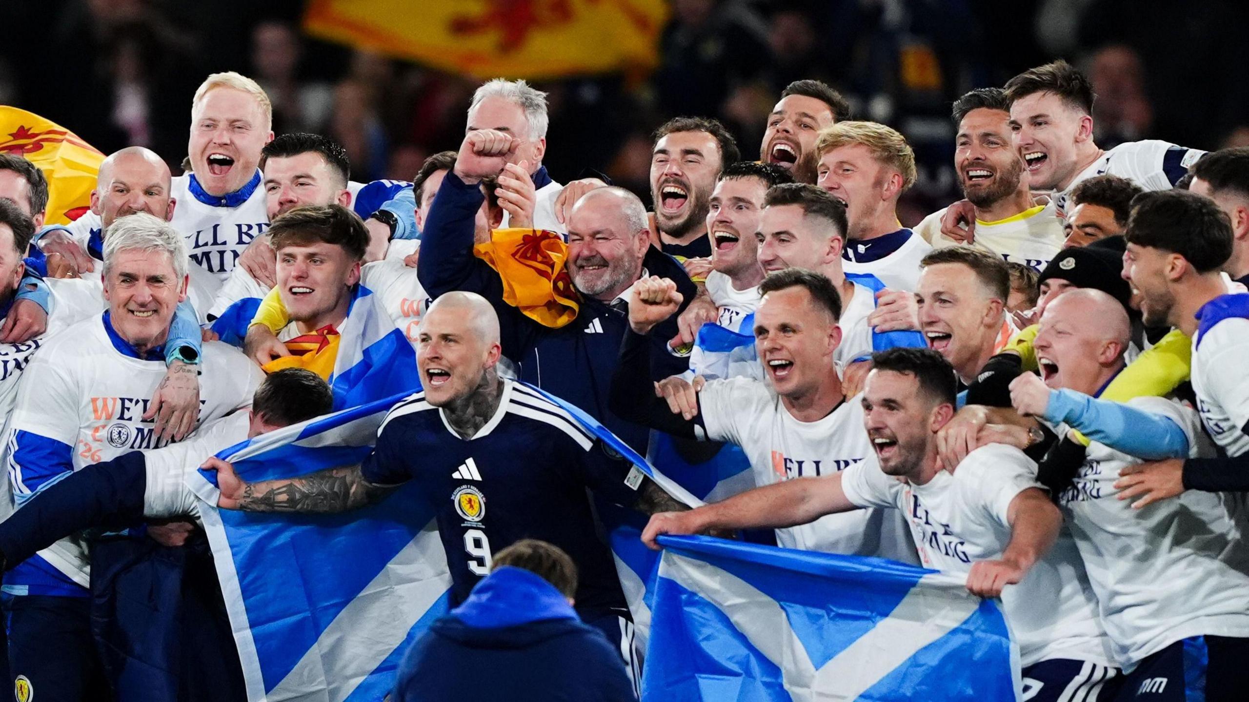Scotland players celebrating after securing qualification for the country's first men's World Cup since 1998.
