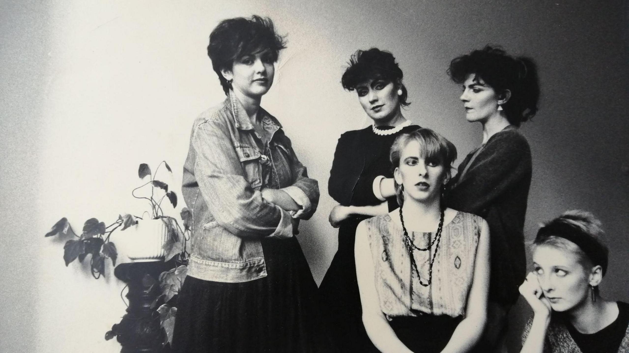 1980s band Sophisticated Boom Boom strike a pose, mostly with their arms folded.