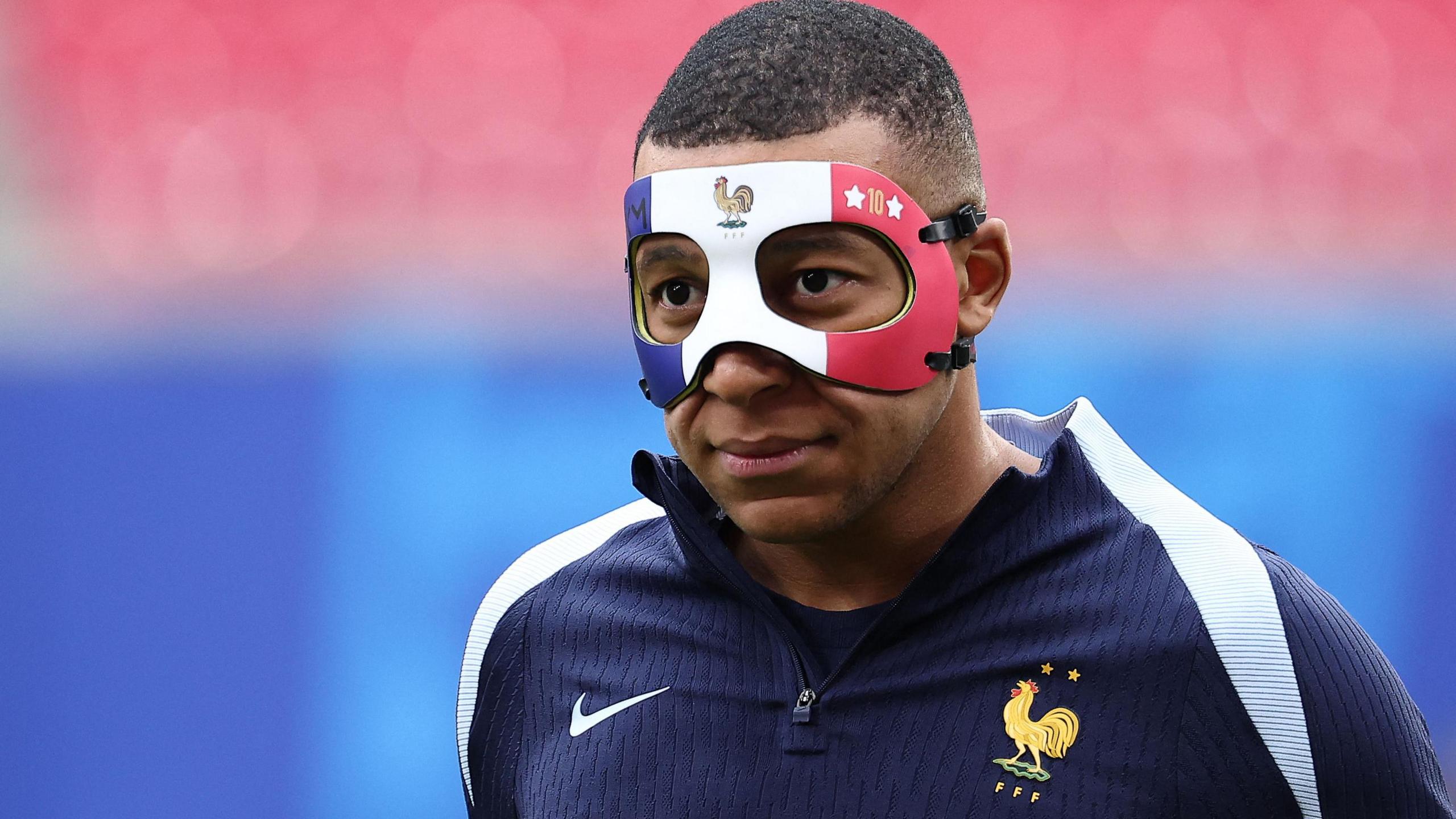 Kylian Mbappe wearing a mask