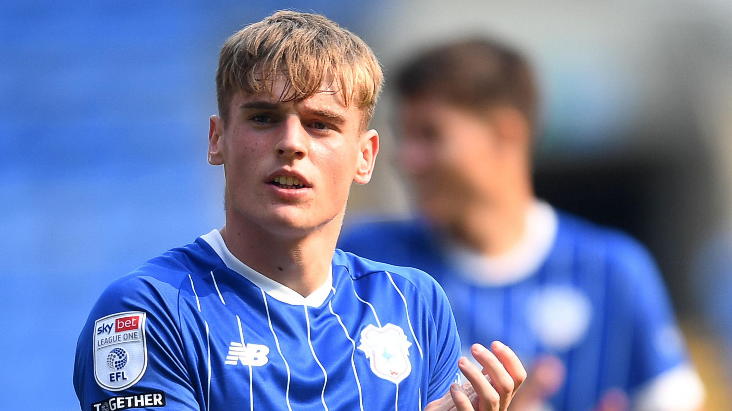 Cardiff City centre-back Dylan Lawlor applauds