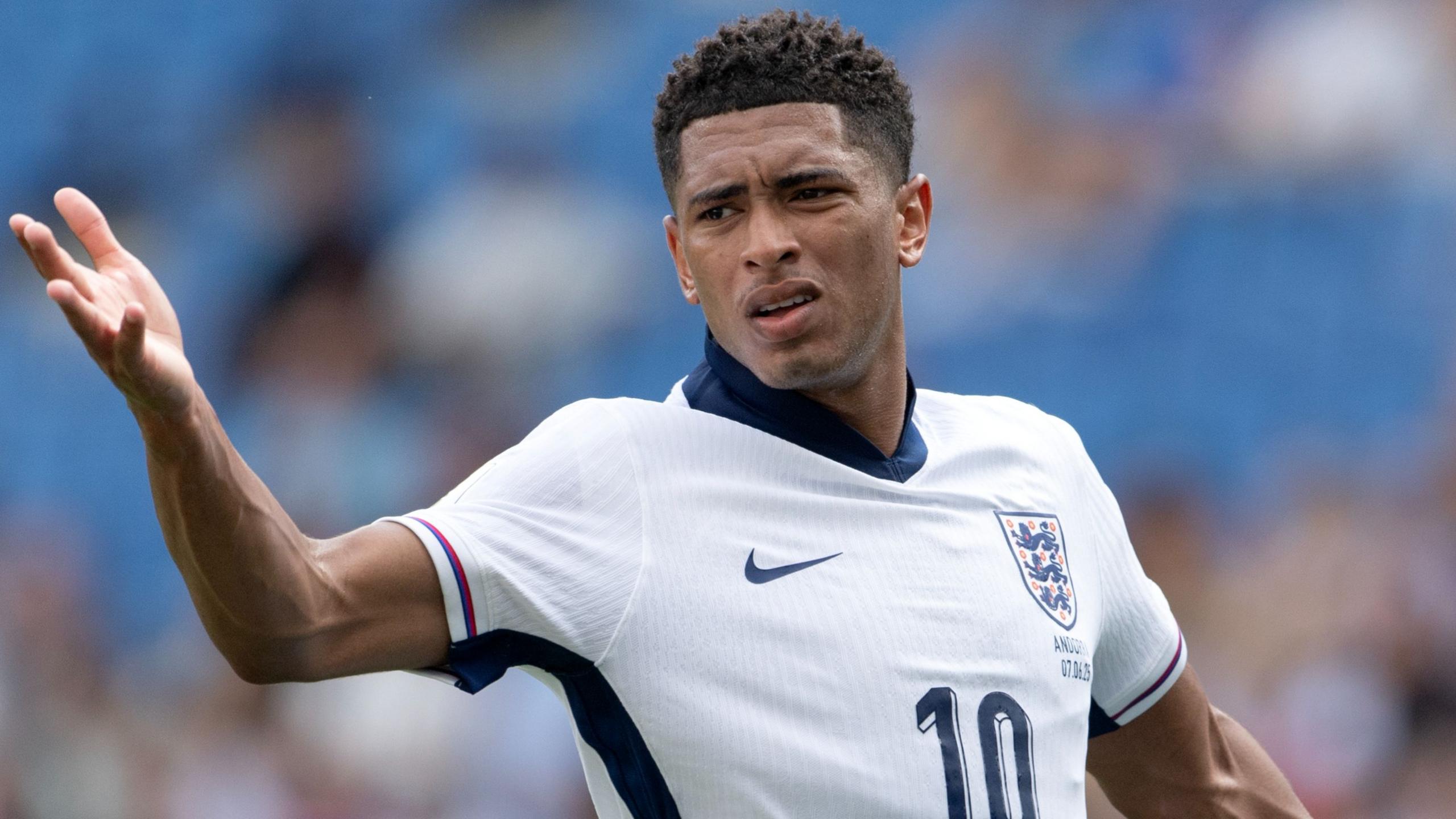 Jude Bellingham scowls while raising his arm