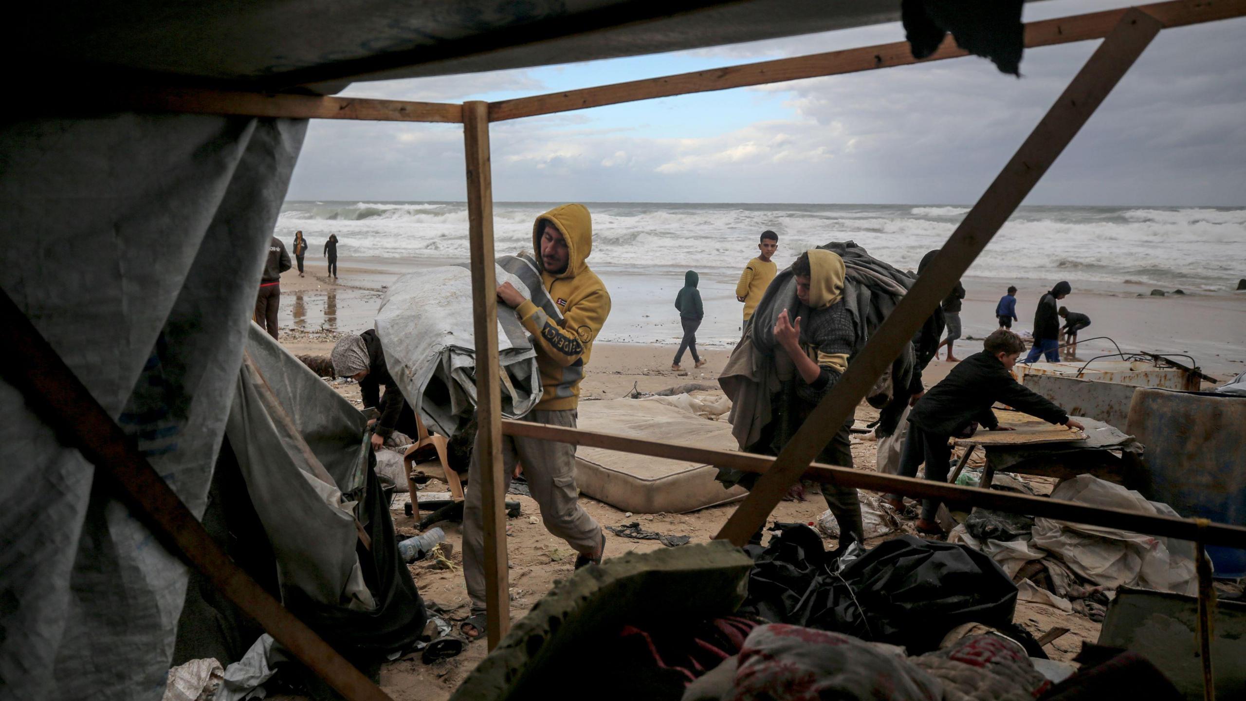 Displaced Palestinians living in makeshift shelters on Gaza's Mediterranean coast near Deir al-Balah, central Gaza