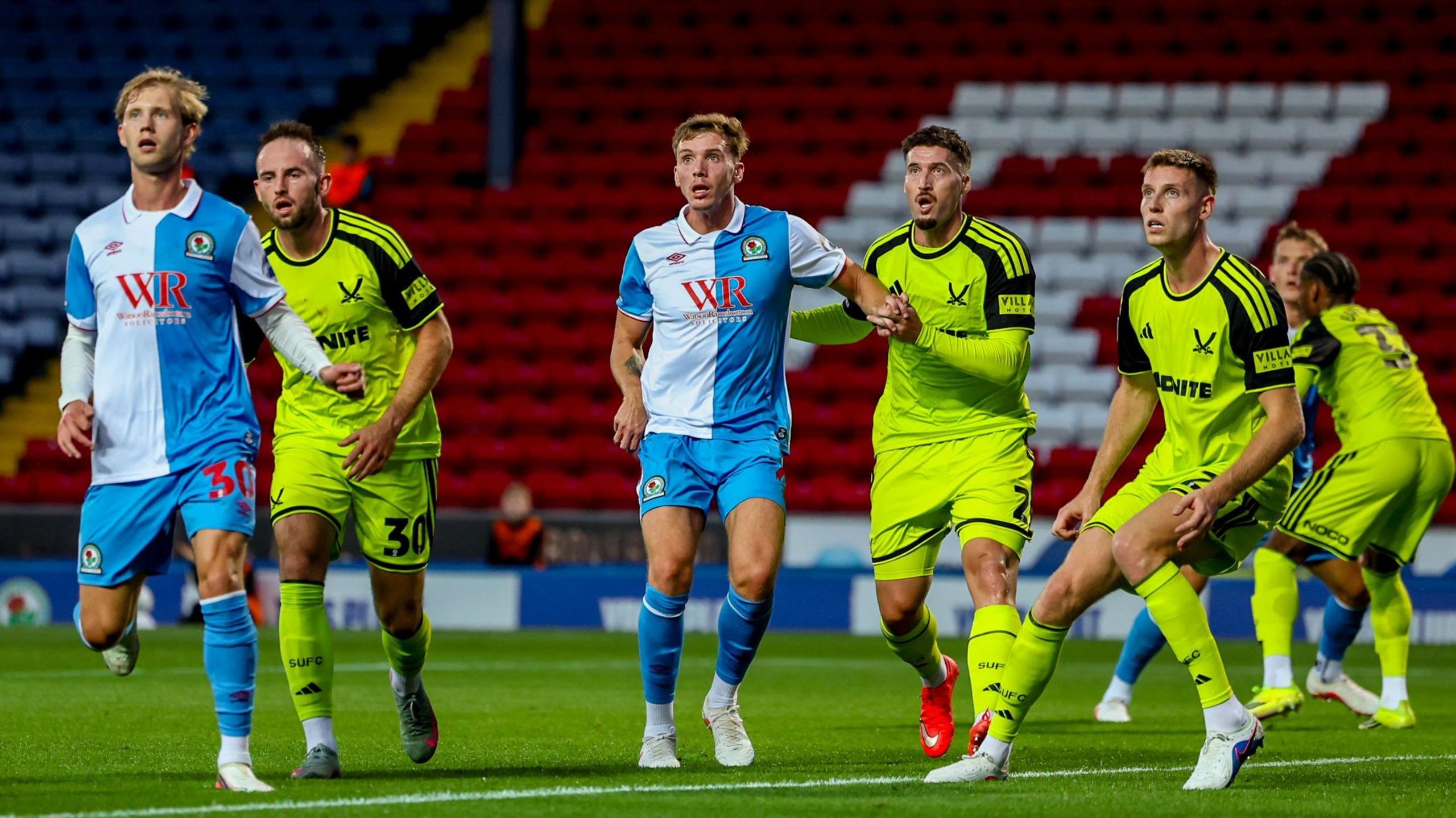 Blackburn Rovers and Sheffield United players challenge for a corner kick