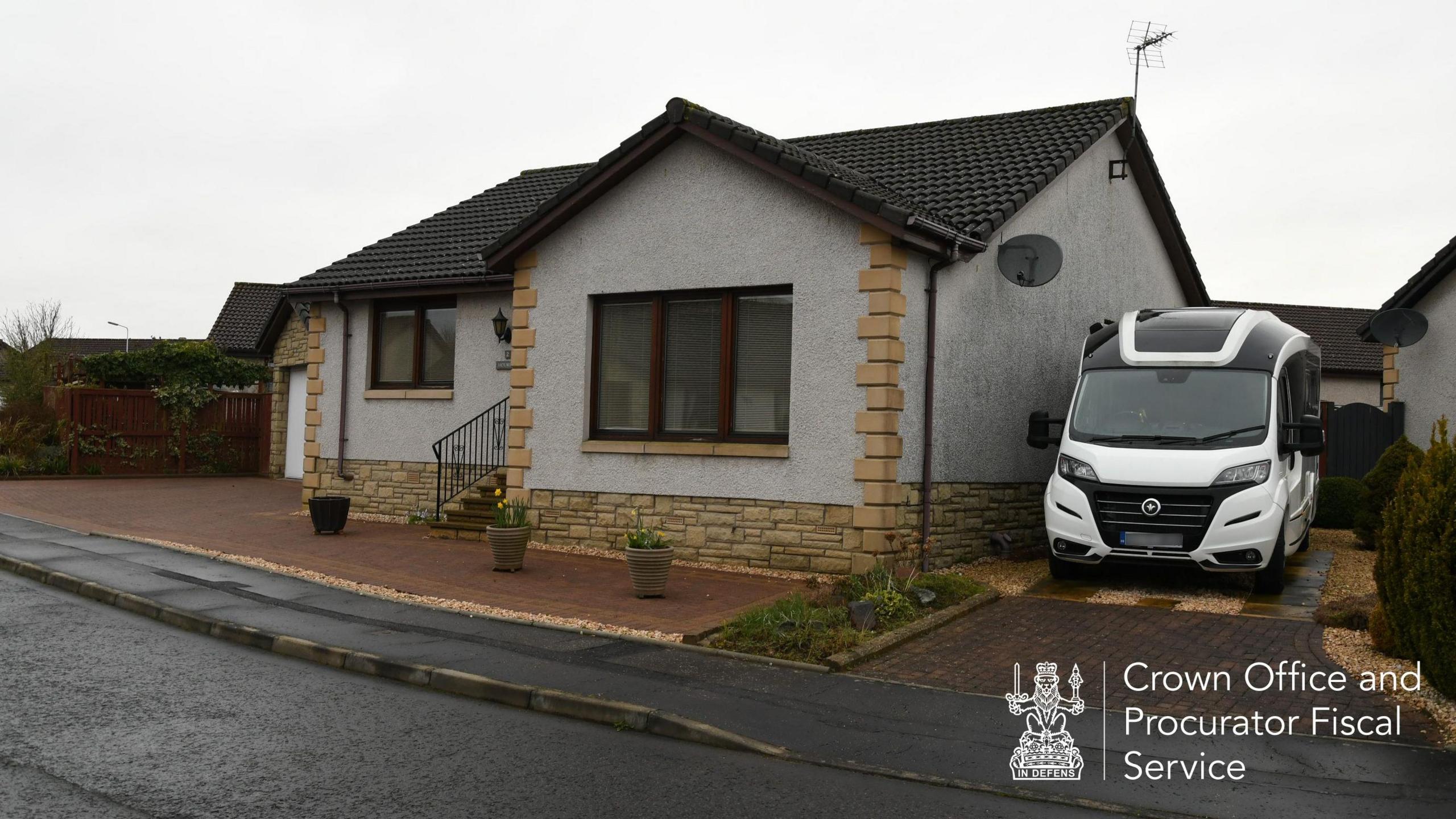 Crown Office photograph of Peter Murrell's mother house. It is a modern bungalow with a large front window. The motorhome is parked in a driveway on the right. 