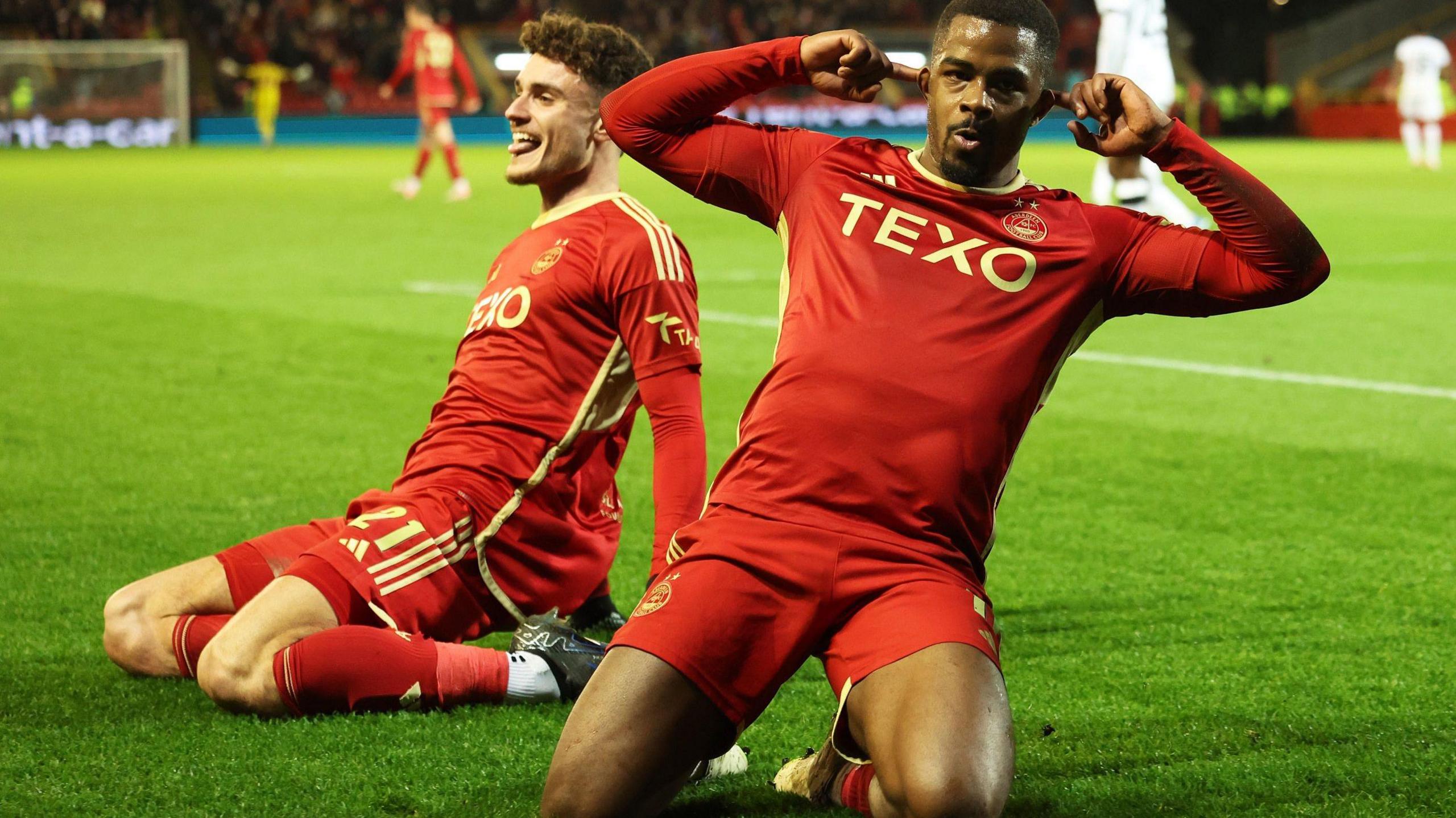 Aberdeen's Dante Polvara and Duk celebrate