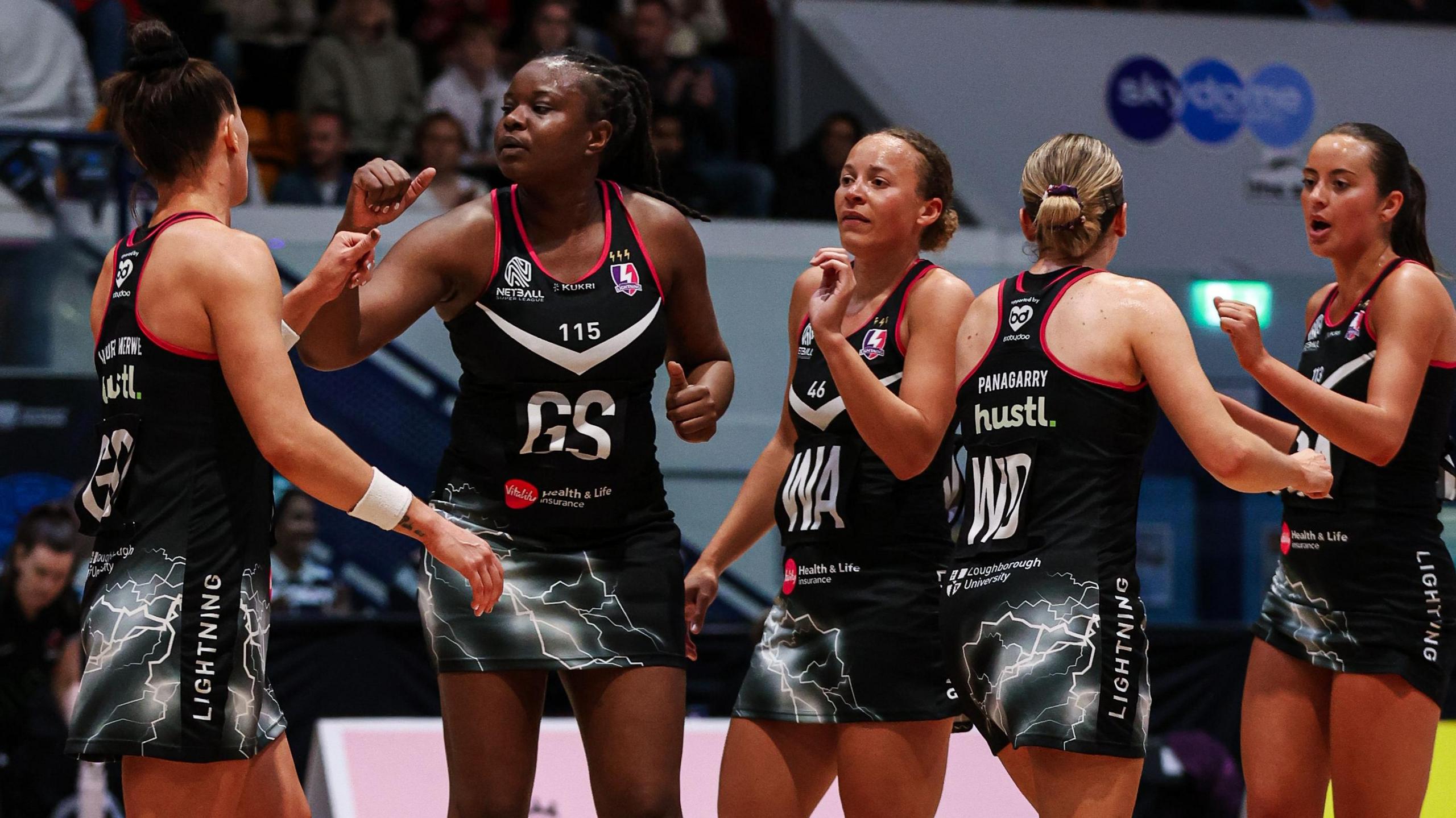 Five Loughborough Lightning players celebrate together