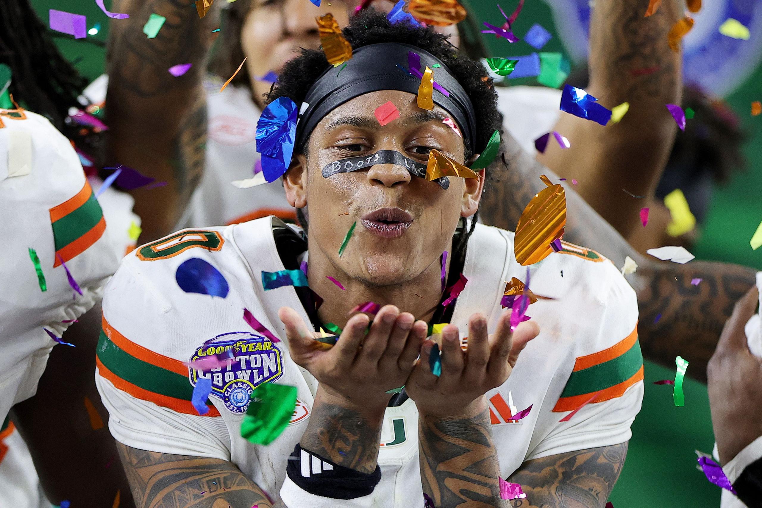 The Miami Hurricanes' Keelan Marion celebrates after his side defeated the Ohio State Buckeyes 24-14 during the 2025 College Football Playoff Quarterfinal in Arlington, Texas. Photo by Alex Slitz