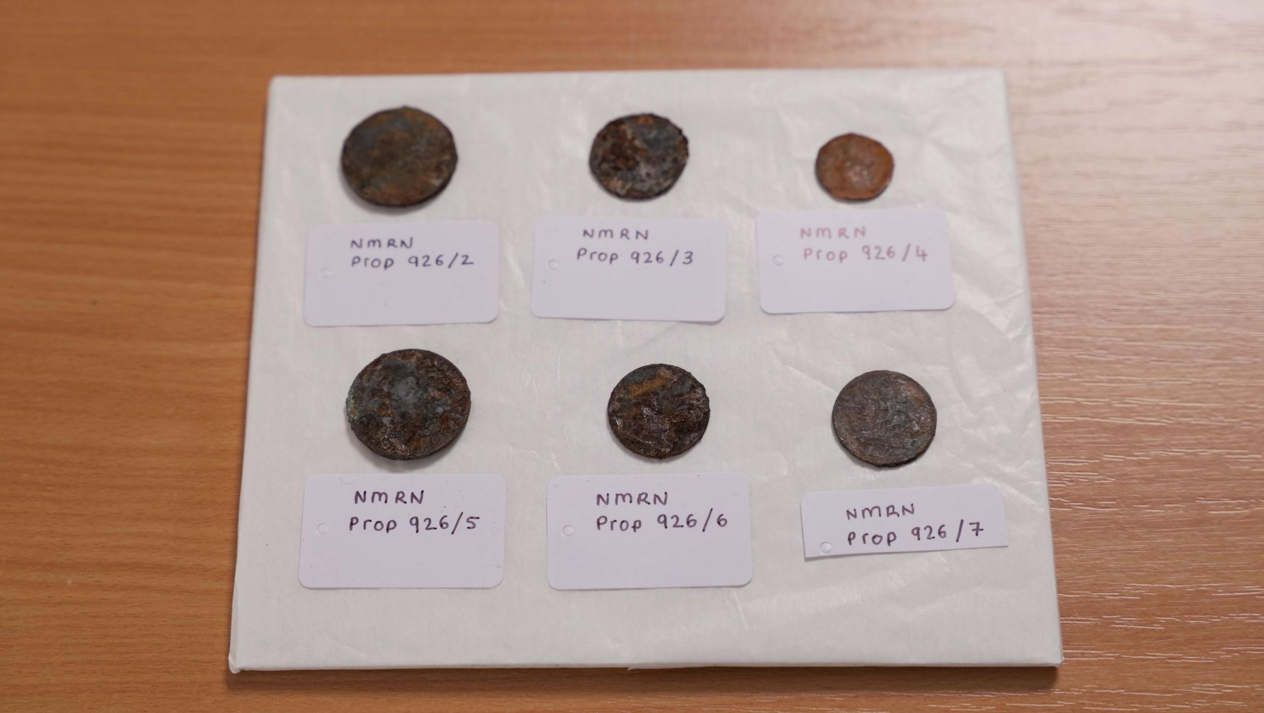 Six coins dating back to the 19th centuries which have been discovered beneath the foremast of HMS Victory after the masts were removed in the latest stage of a 10-year £42 million restoration project.