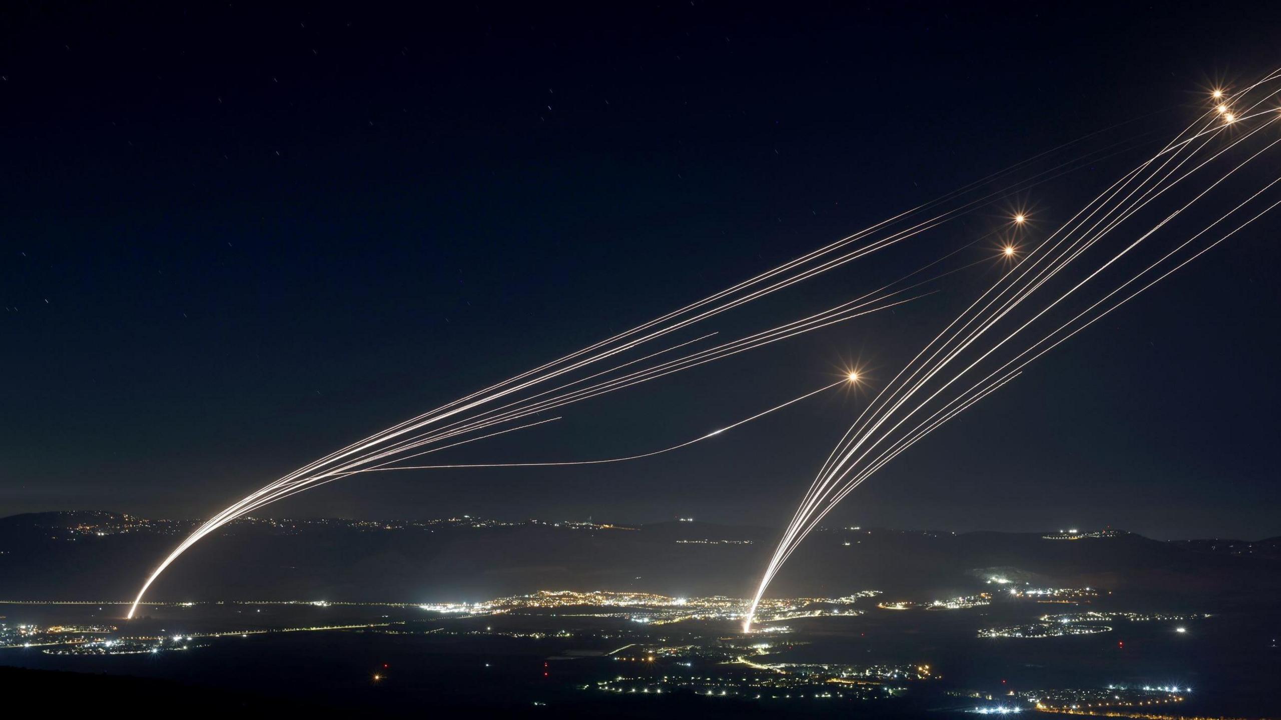 Projectiles fired from the Israeli Iron Dome air defense system to intercept missiles fired from southern Lebanon, over the upper Galilee, northern Israel, early 04 August 2024. 