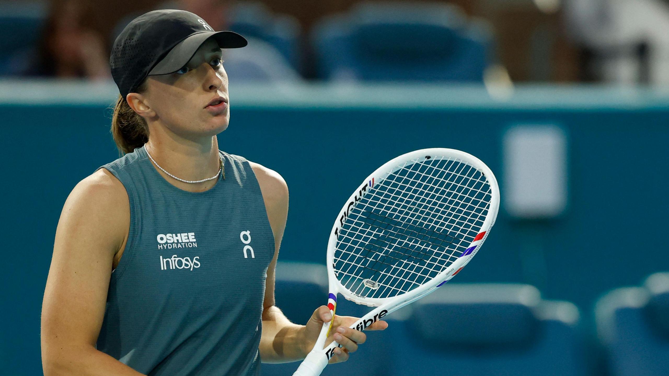 Iga Swiatek (POL) reacts after missing a shot against Magda Linette (POL)