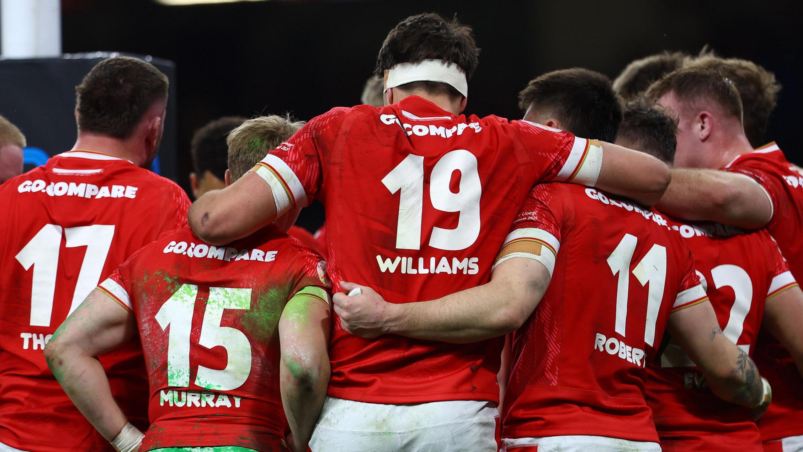 Wales team in a huddle against England