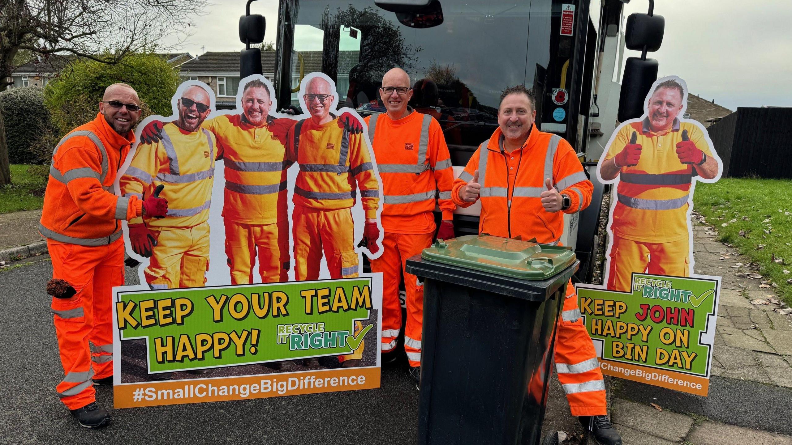 Refuse collectors Damian, Carl and John stand next to their cardboard cut-outs which form part of the education campaign 