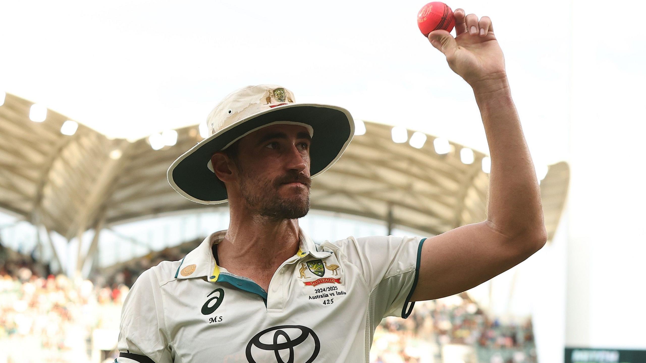 Mitchell Starc acknowledges applause for his pink-ball performance against India