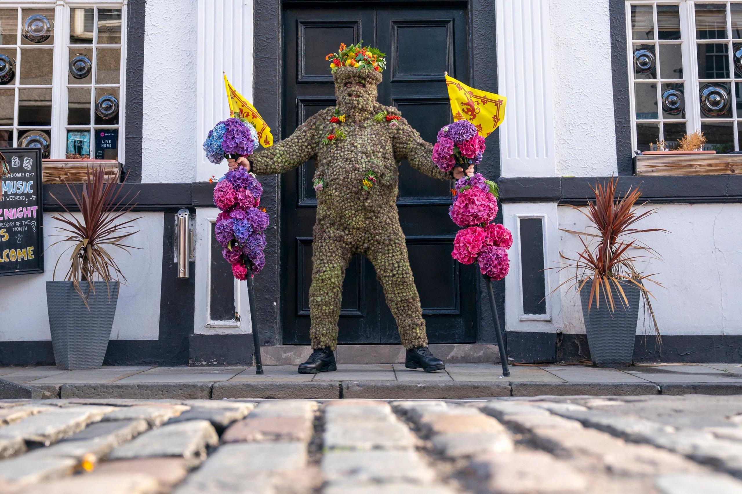 Burryman in front of the Staghead pub