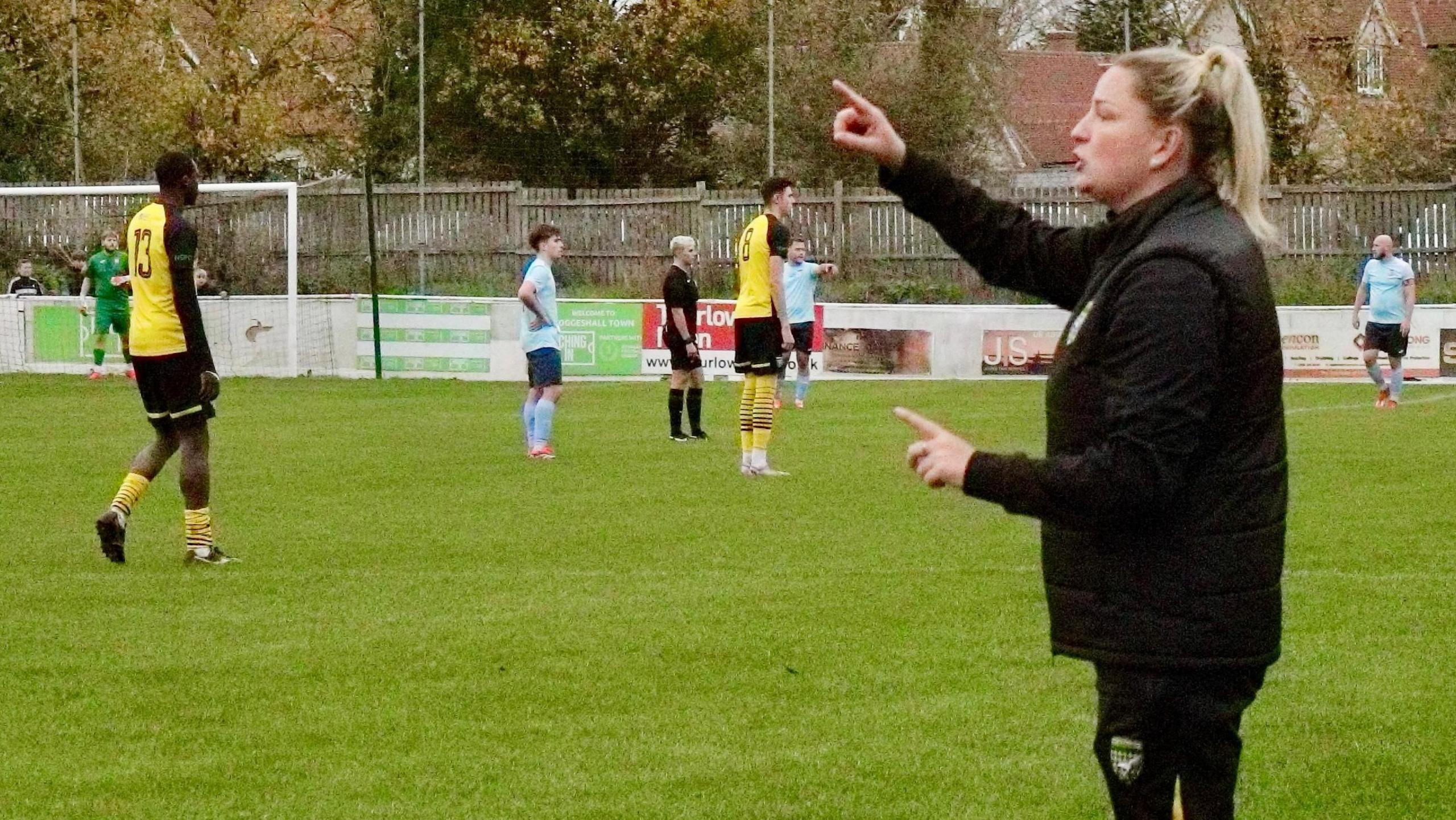 Rosi Webb on the touchline coaching Stanway Pegasus FC