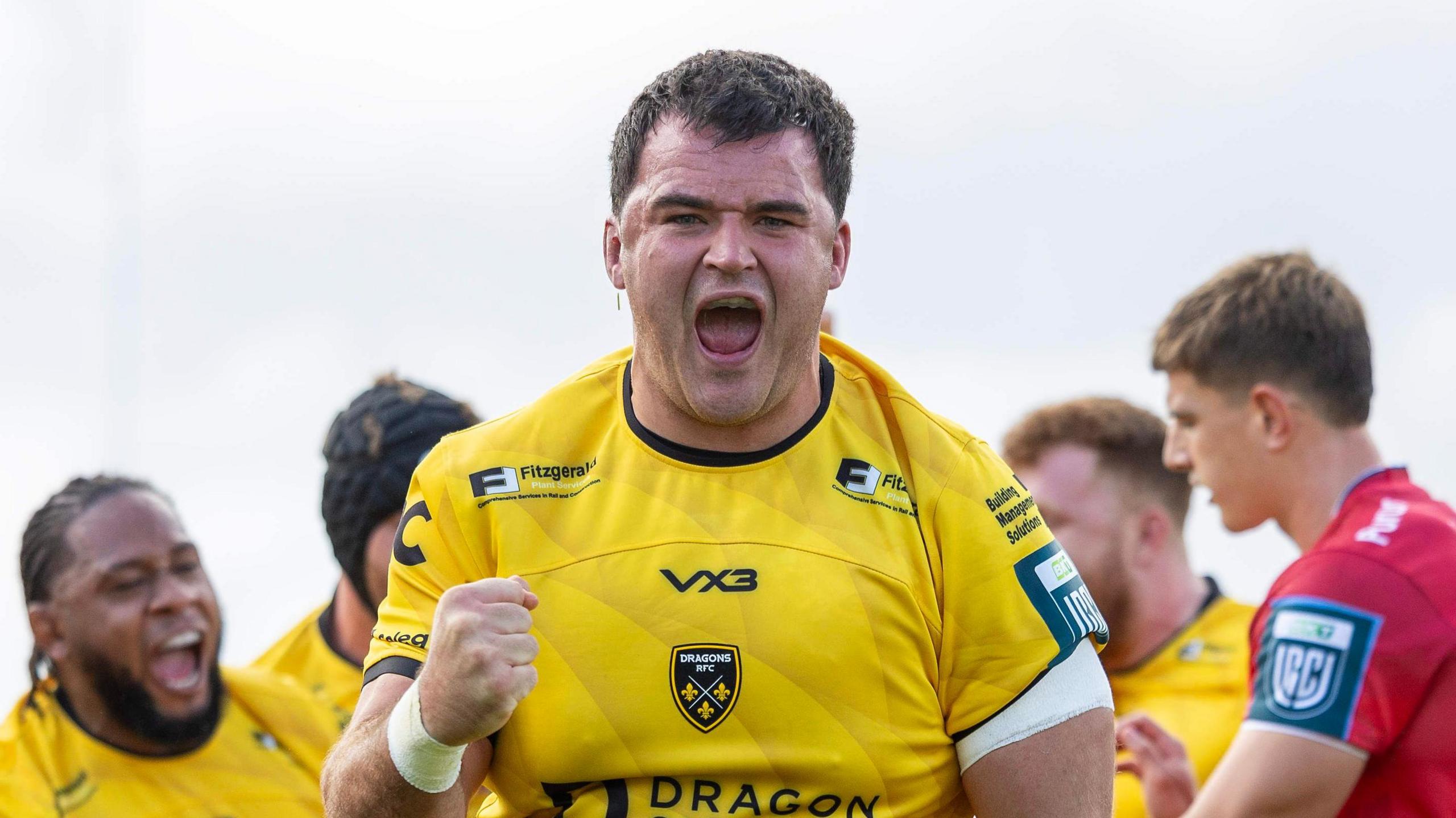 Dragons prop Chris Coleman celebrates a try against Scarlets