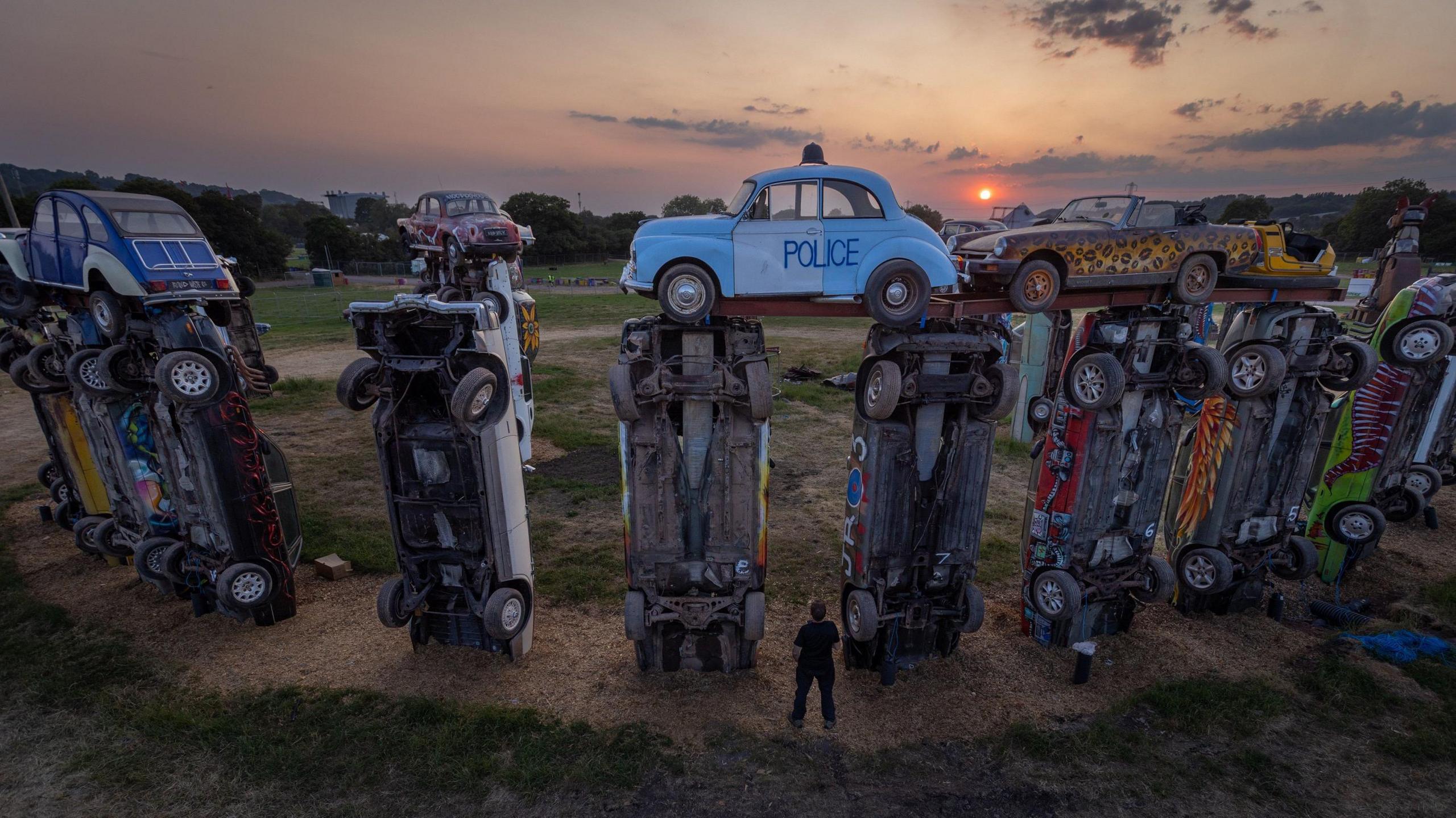 A drone image shows Carhenge at sunrise during the 2023 solstice 