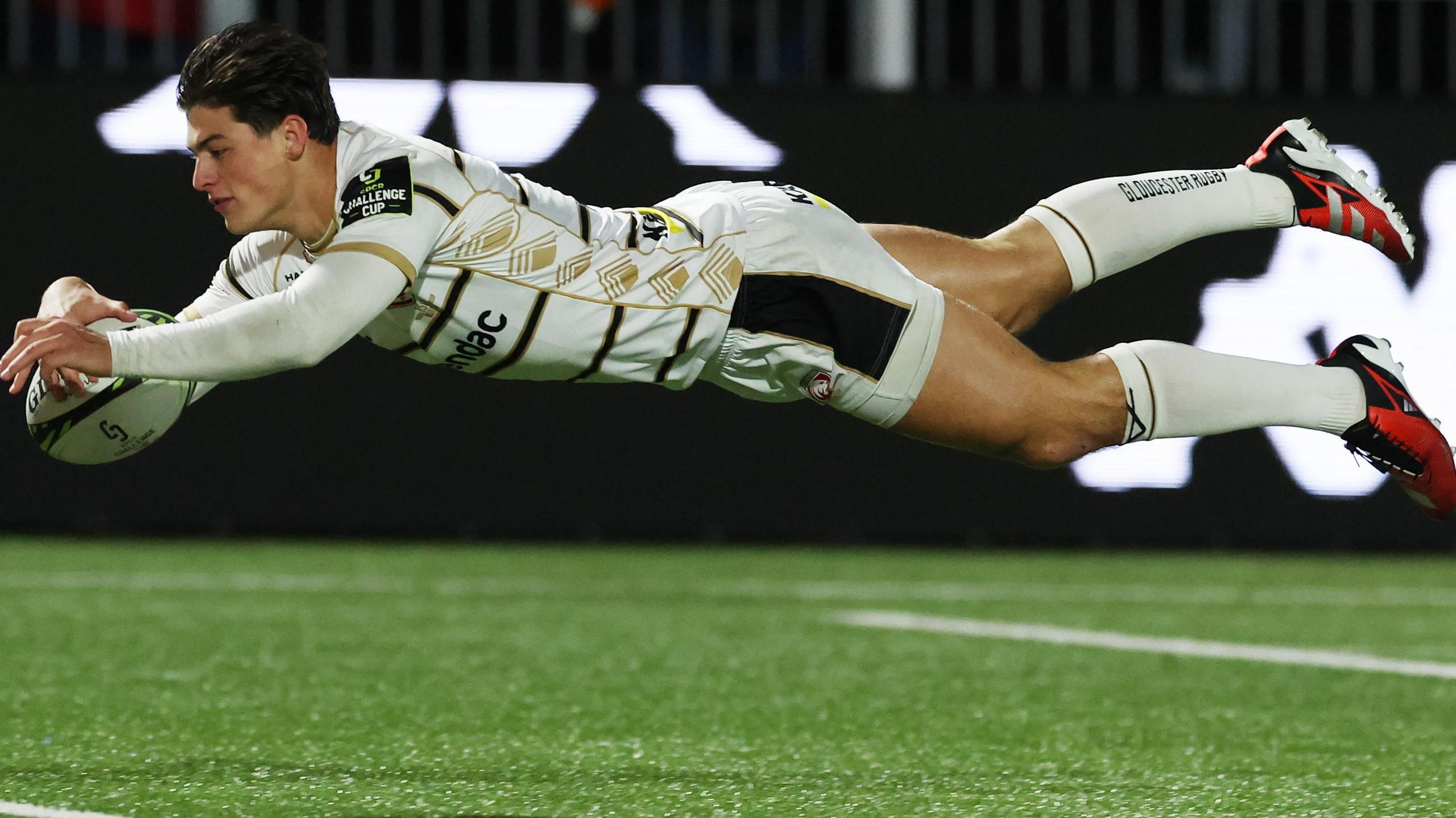 Louis Rees-Zammit dives over to score a try for Gloucester