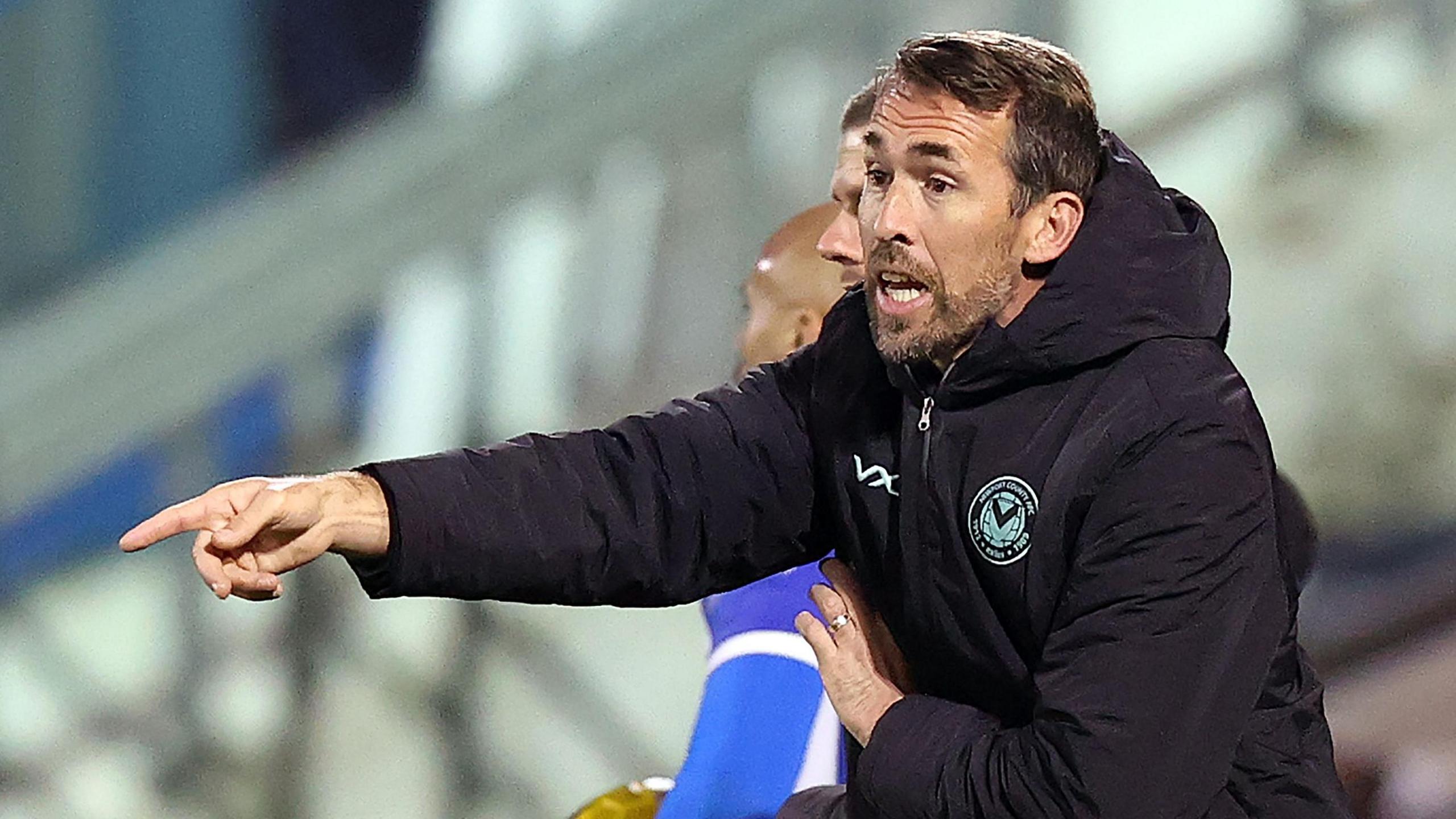 Christian Fuchs shouts instructions to Newport's players