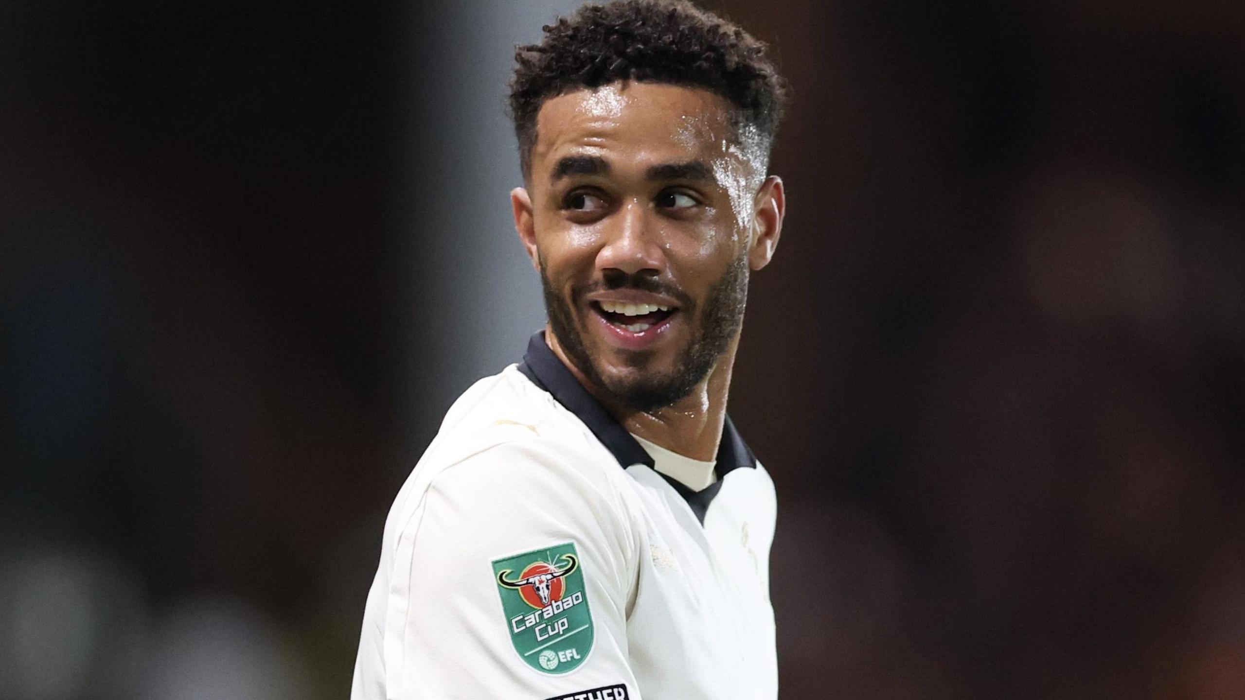 George Hall looks over his shoulder as play restarts during a match for Port Vale.