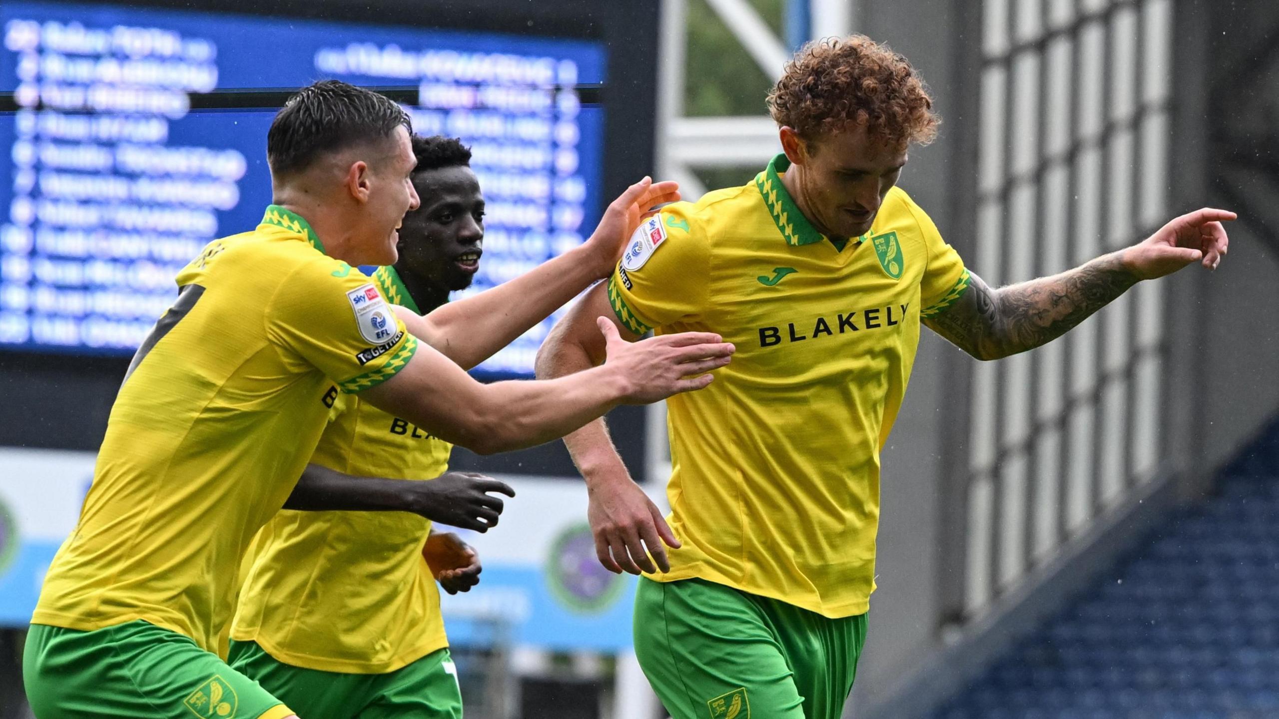 Norwich City striker Josh Sargent (right) celebrates his goal at Blackburn Rovers with teammates.