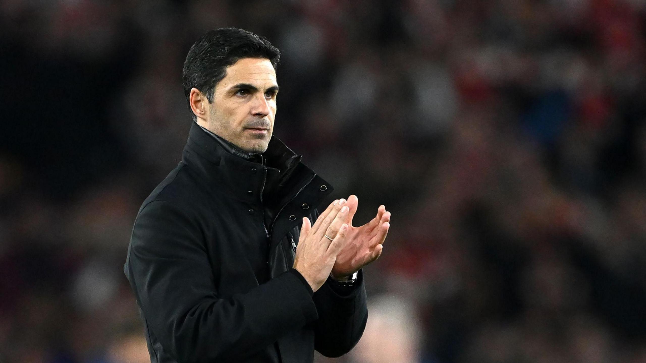 Mikel Arteta applauds after match