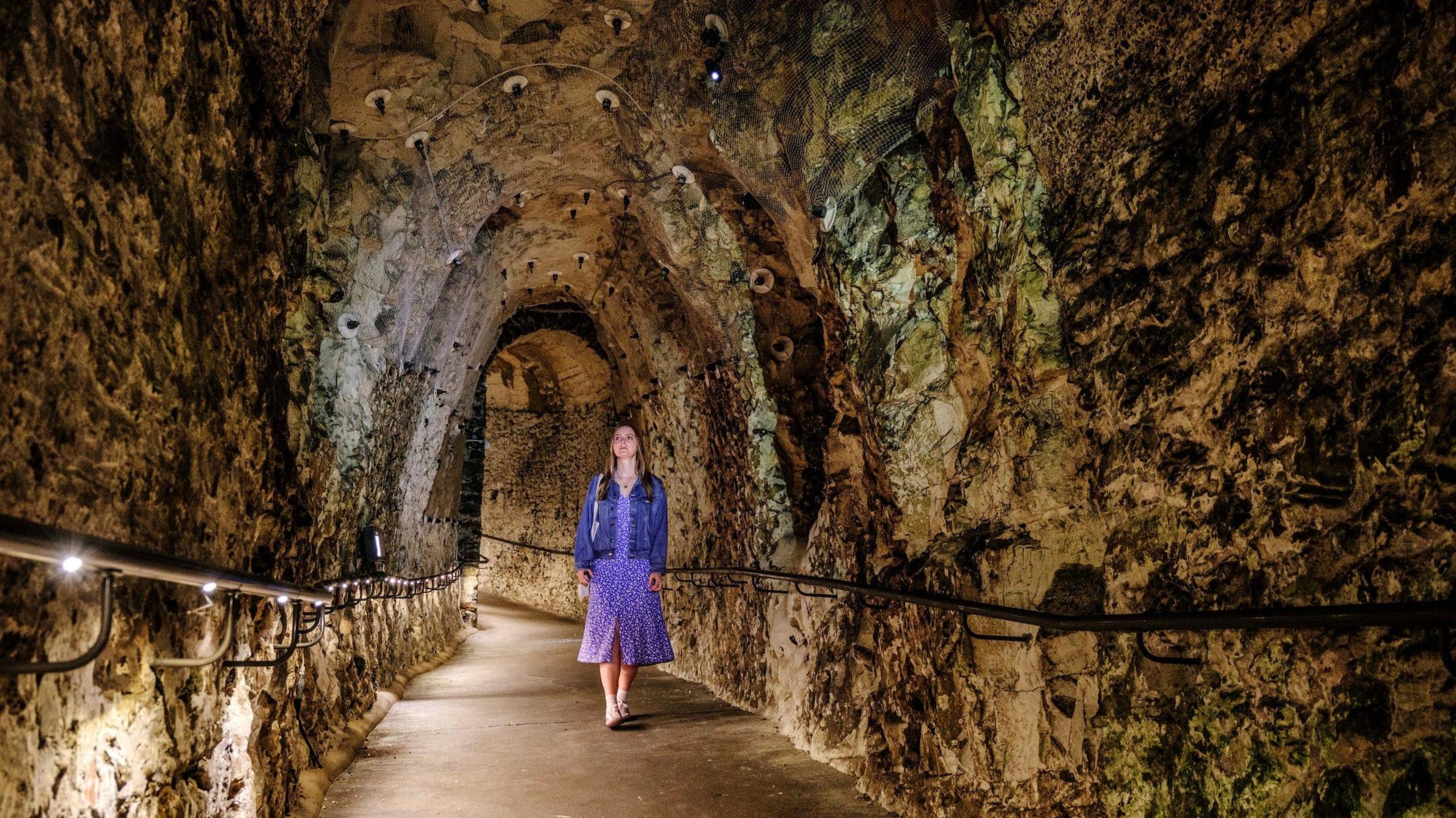 A women walking in a tunnel