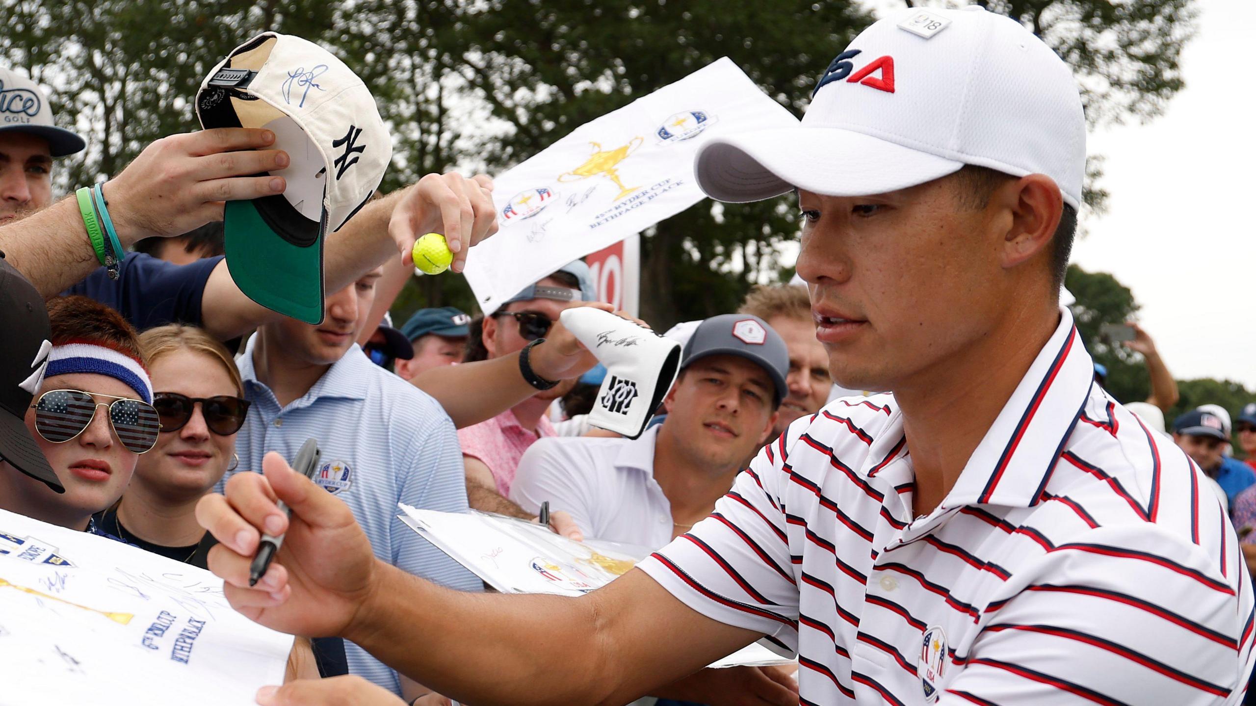 Collin Morikawa signs autographs for fans at the 2025 Ryder Cup