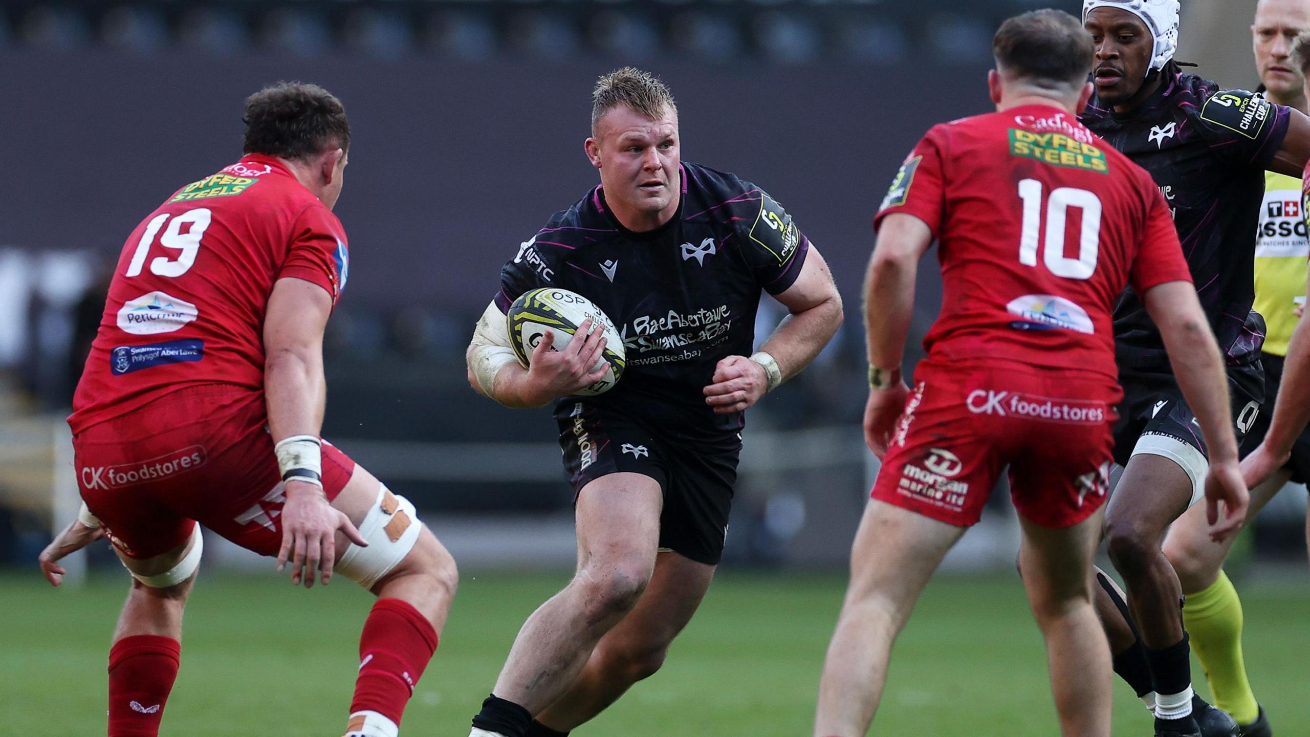 Dewi Lake carries the ball for Ospreys against Scarlet